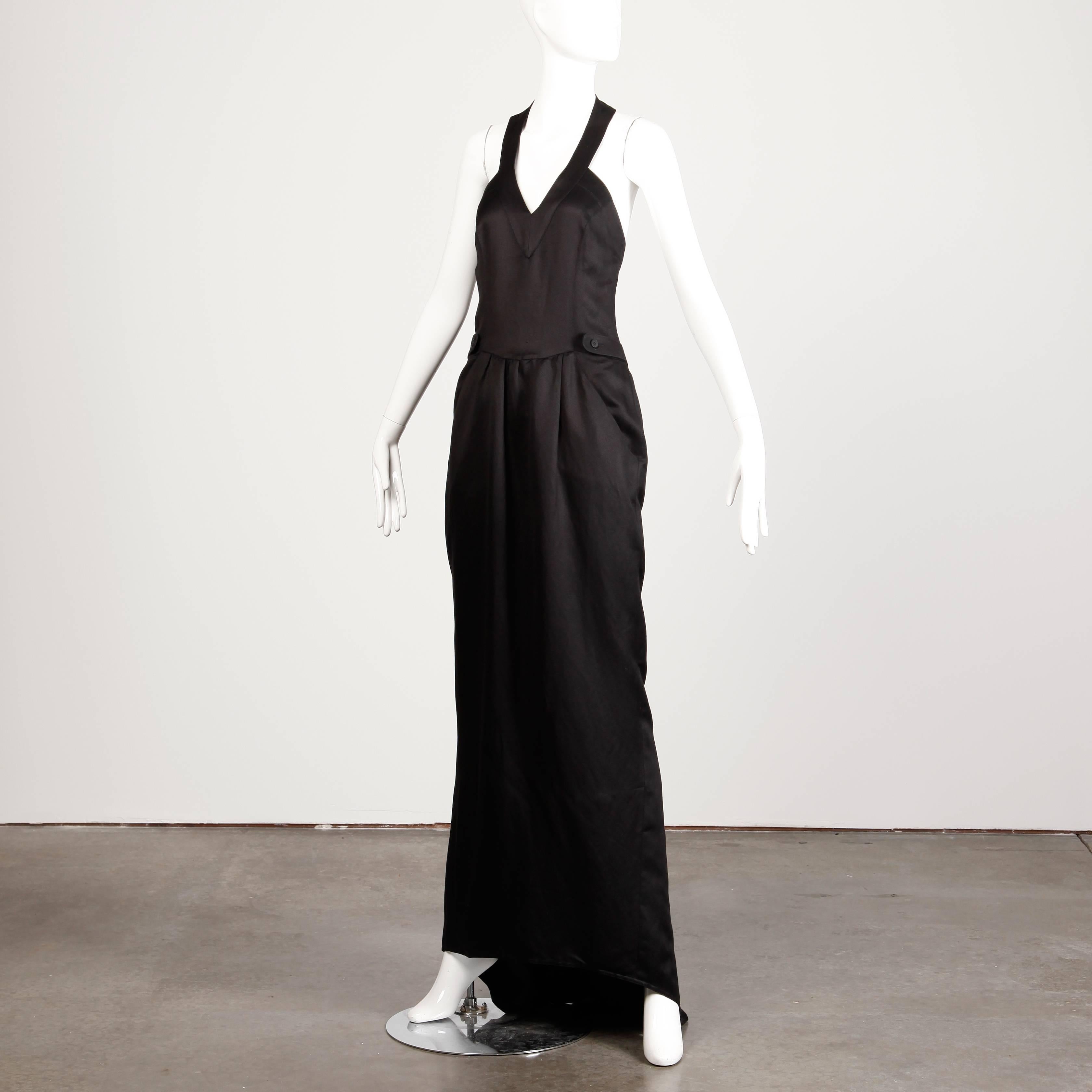 Rare Fendi label! Fendi 365 for Neiman Marcus vintage black linen blend gown with a halter neckline and back train that can be buttoned up and down as you like. Plunging neckline and open back. 

Details: 

Partially Lined
Front Slit