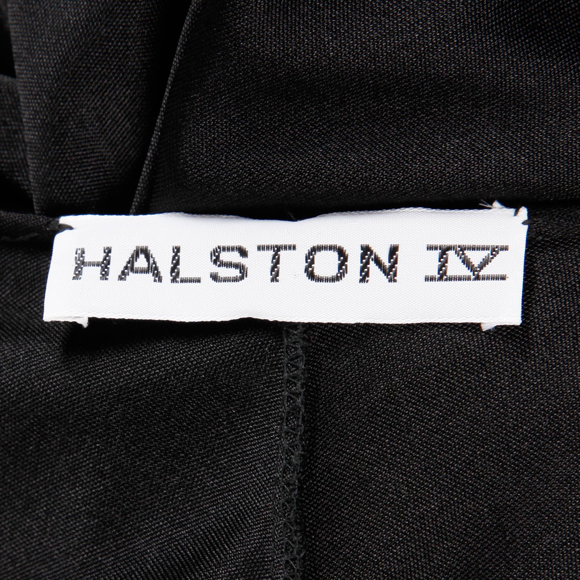 Rare Halston IV label! Vintage 1970s black cocoon caftan maxi dress with deep-V plunging neckline, dolman sleeves and a front slit. Slinky nylon fabric and iconic Halston silhouette.

Details: 

Unlined
Marked Size: One Size Fits All
Color: