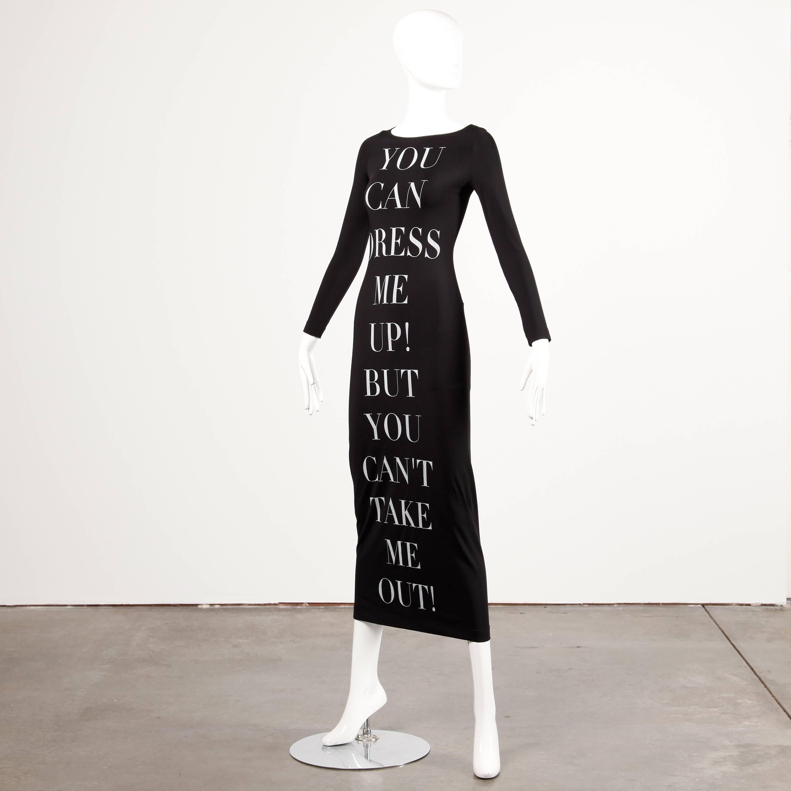 Possibly THE most iconic Moschino dress. Slinky black jersey knit maxi dress with white lettering that reads, 