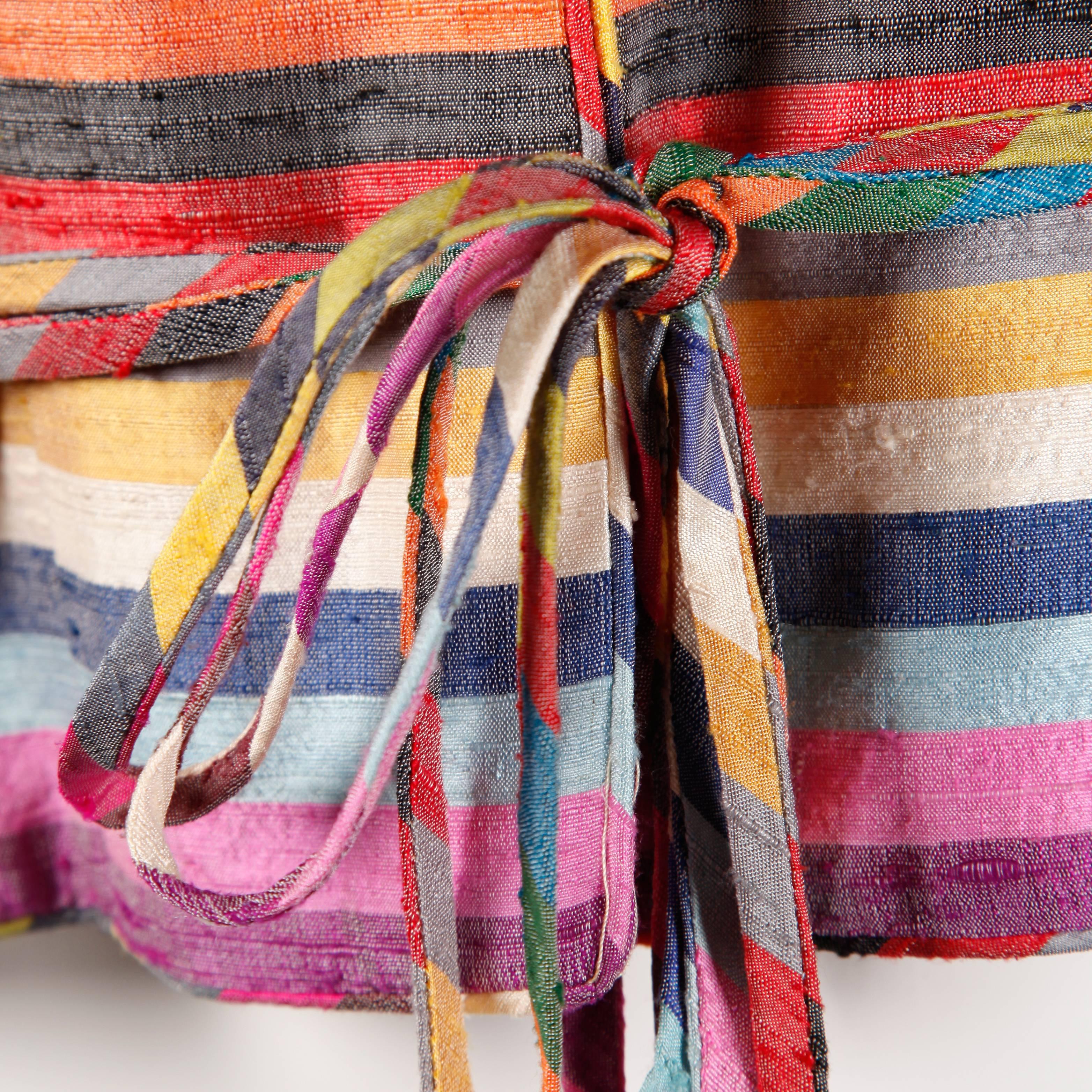 Amazing raw silk jacket in vibrant rainbow stripes by Tally Boutique. Love the massive balloon sleeves and the tie detail at the waist.

Details: 

Fully Lined
Front Metal Hook Closure/ Tie Belt at Waist
Marked Size: Unmarked
Estimated Size: