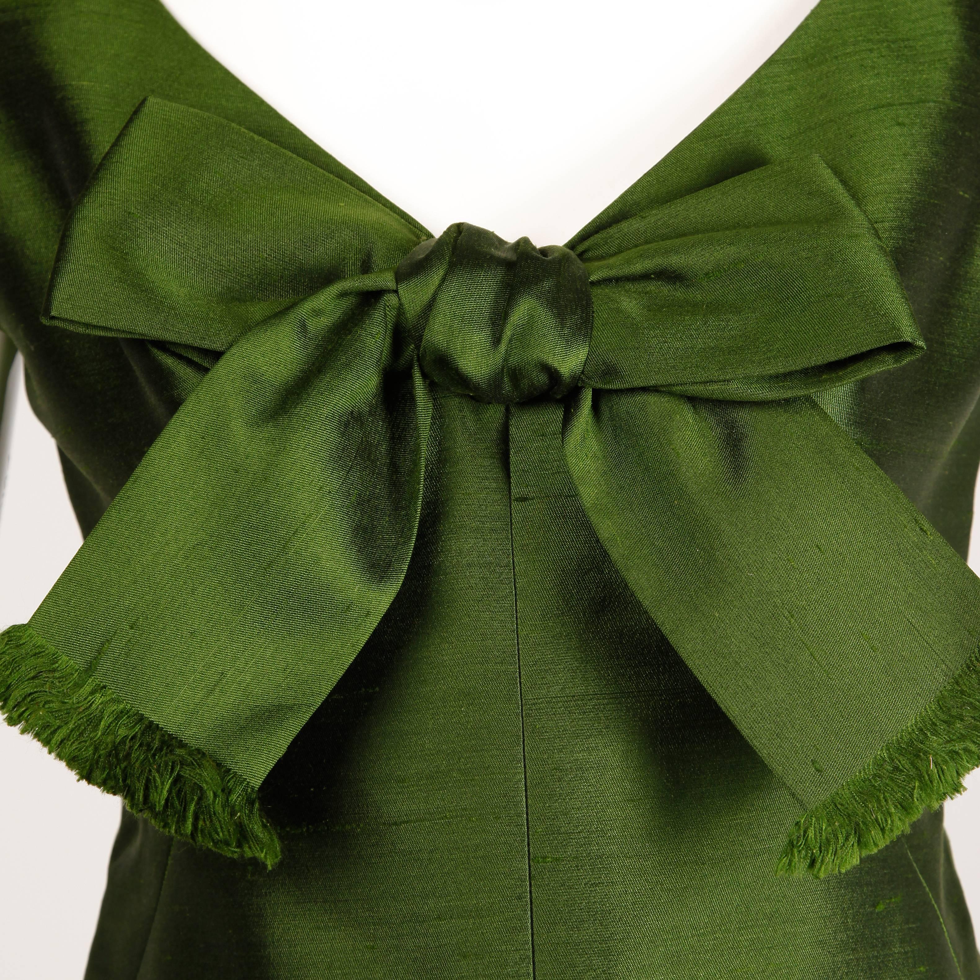 Beautiful olive green silk shantung maxi dress from the 1960s by Nan Duskin.

Details: 

Unlined
Back Metal Zip with Hook Closure
Estimated Size: Medium
Color: Olive Green
Fabric: Silk 
Label: Nan Duskin

Measurement: 

Bust: