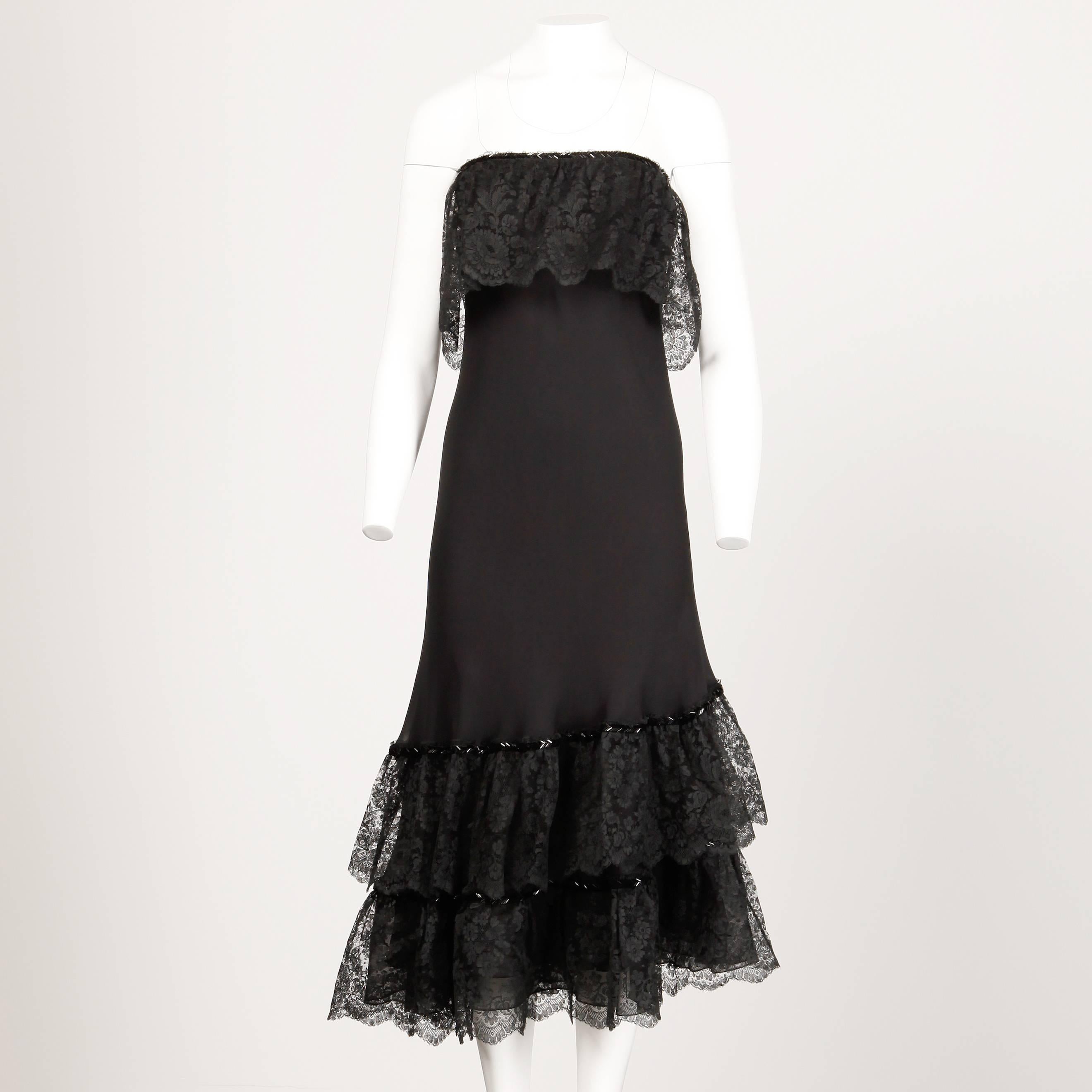 Beautiful delicate black silk strapless dress with beaded lace trim and matching wrap by George Stavropoulos. Flattering cut with asymmetric hemline.

Details: 

Fully Lined in Silk 
Back Zip with Hook Closure
Estimated Size: Small
Color: