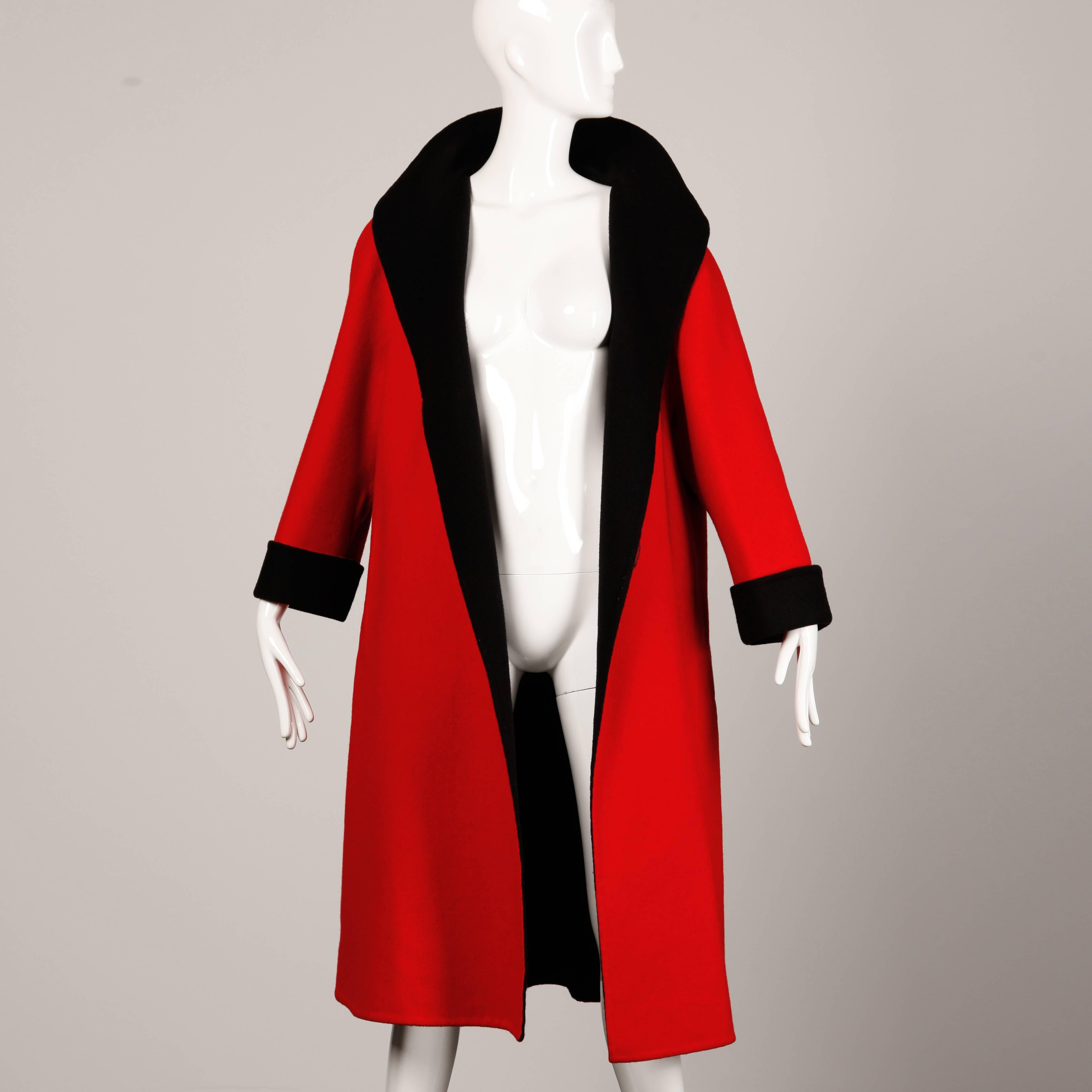 Gorgeous vintage red and black wool swing coat by Pauline Trigere for Nan Duskin.

Detail: 

Unlined
Front Slit Pockets
Inside Tie Closure
Estimated Size: Free (S-L)
Color: Black/ Red
Fabric: Wool 
Label: Pauline Trigere/ Nan