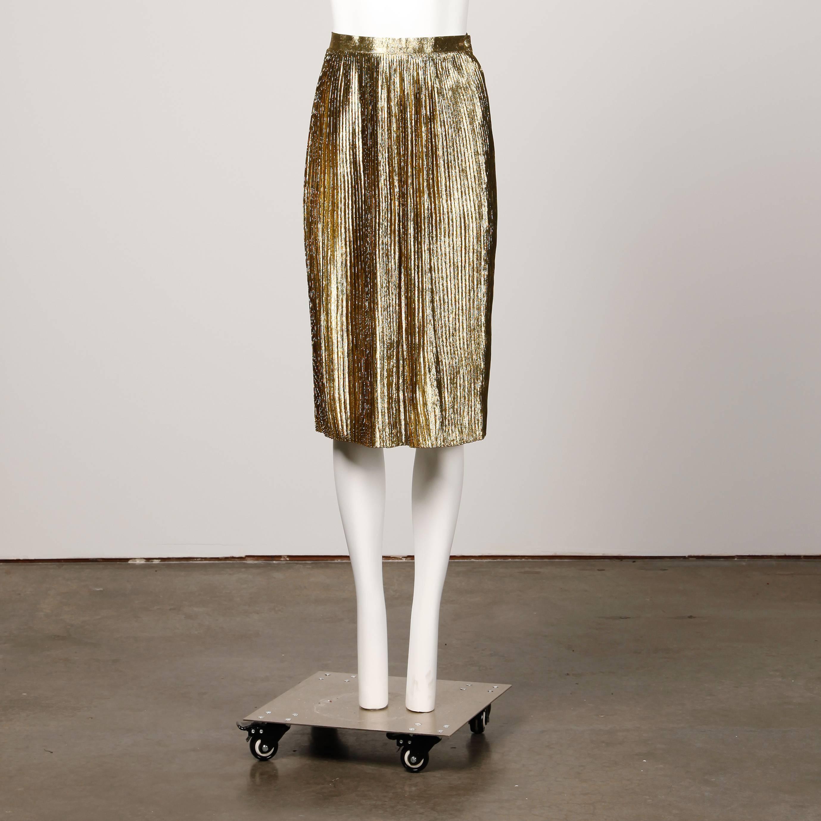 Shiny metallic gold lamé pleated pencil skirt by Christian Dior circa 1980s.

Details: 

Unlined
Side Snap and Button Closure
Marked Size: Unmarked
Estimated Size: Small
Color: Metallic Gold
Fabric: 67% Silk/ 33% Polyester
Label: