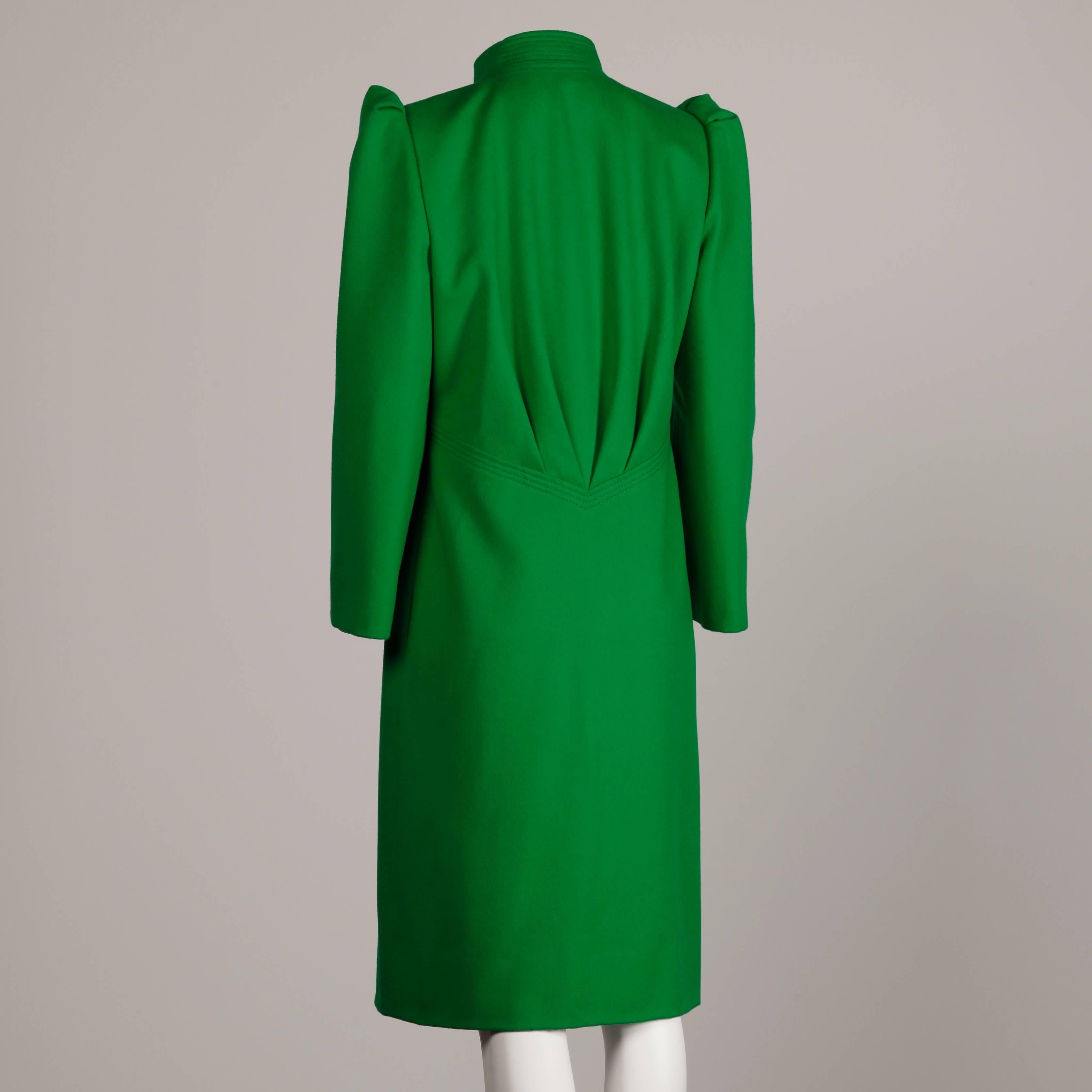 Bright kelly green wool coat with bold shoulders by James Galanos for Amen Wardy. Top stitching detail and angular collar.

Details: 

Fully Lined
Side Seam Pockets
Button Front Closure
Estimated Size: Small
Color: Kelly Green
Fabric: