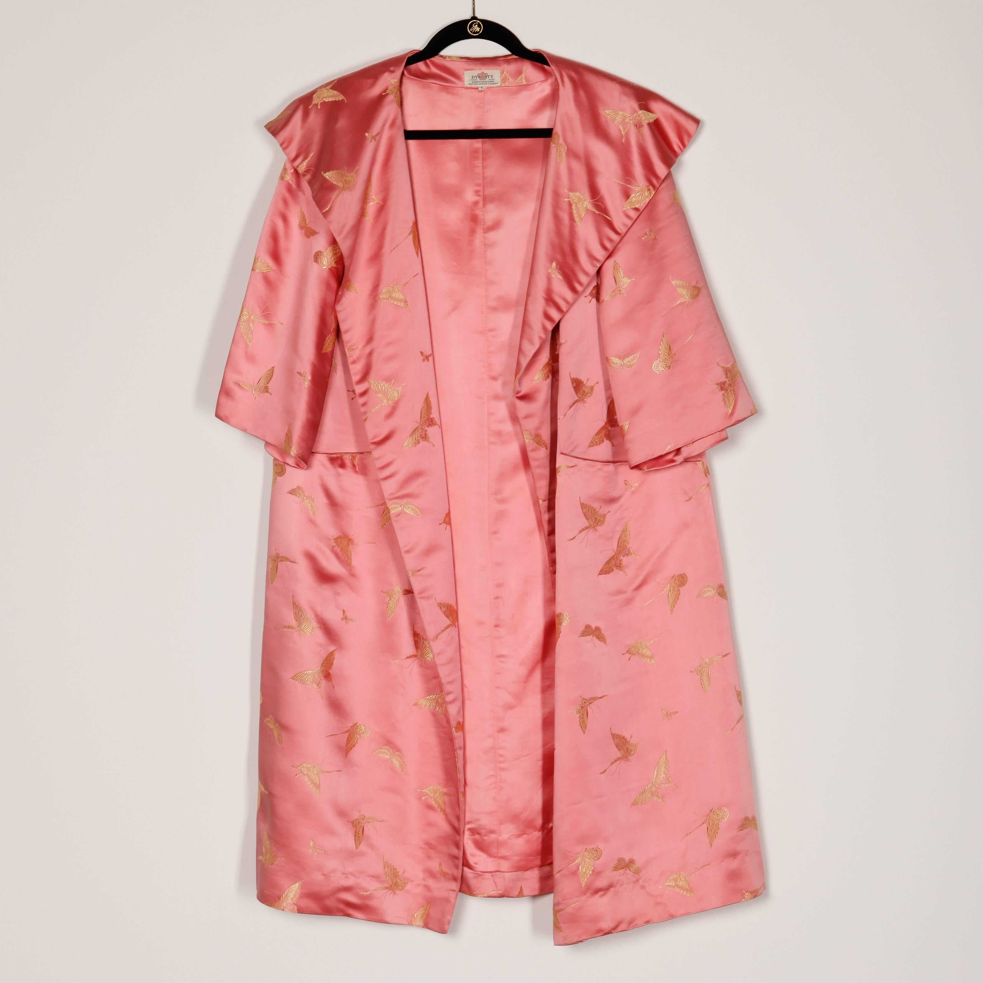 Gorgeous heavy weight pink silk satin swing coat with gold butterflies by Dynasty. Extremely well made with hand stitched seams and beautiful silk fabric. Big pop up collar, 3/4 length sleeves and side pockets.

Details: 

Fully Lined
Front