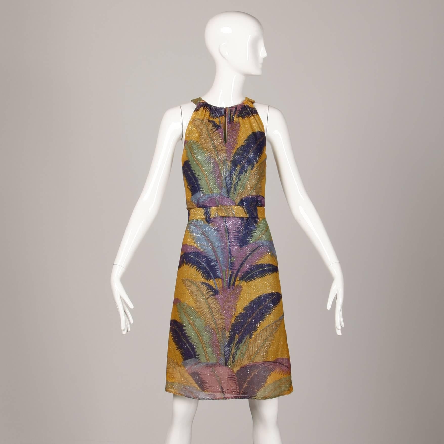 Colorful metallic tropical print halter dress with keyhole neckline by Marchesa di Grésy for I. Magnin. Fully lined with rear metal zip closure. The marked size is 10, but the dress fits like  modern size small. The bust measures 36", waist
