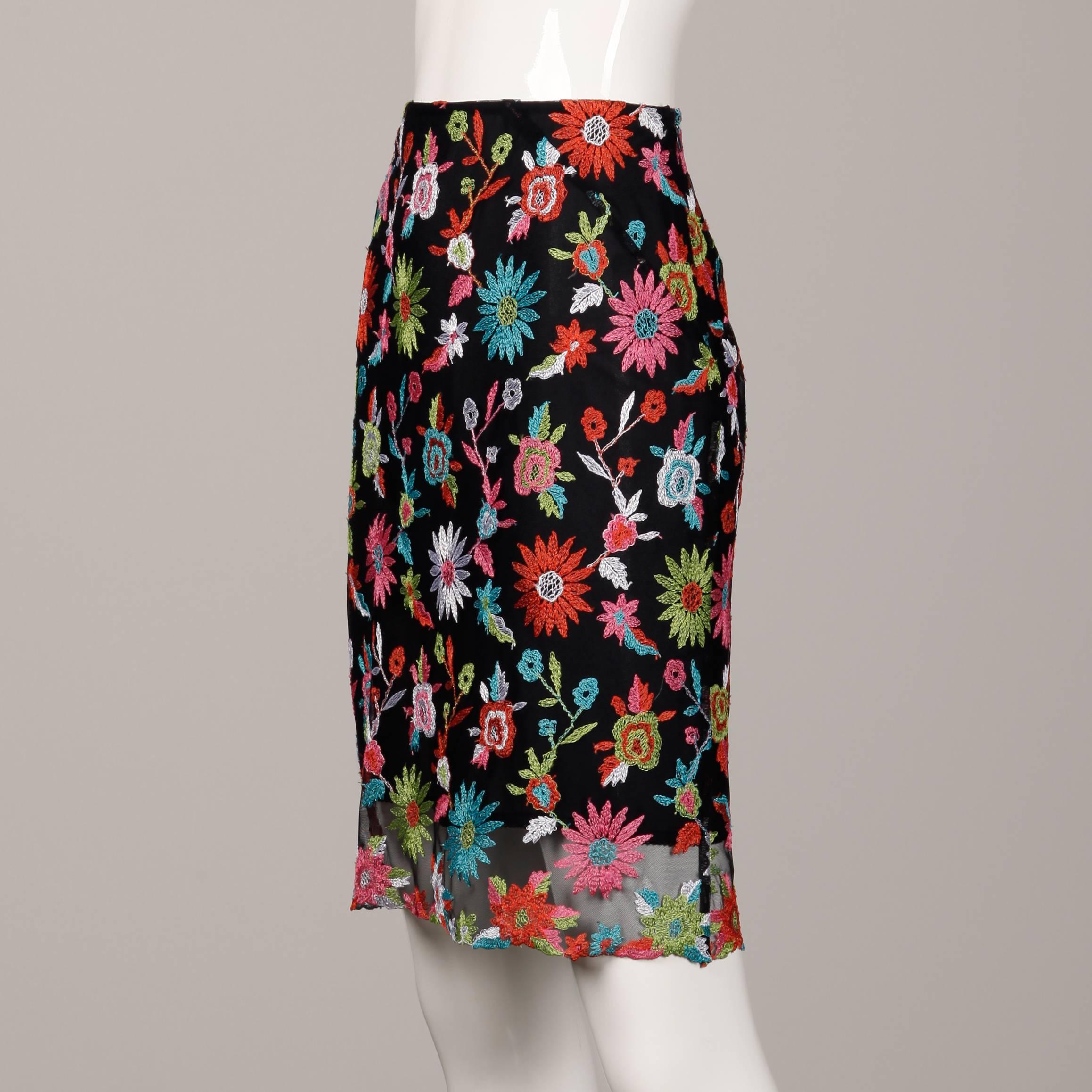 Vintage 1990s mesh skirt with overall floral embroidery by Christian Lacroix. Fully lined with size zip closure. 100% polyester. The marked size is 36 and the skirt fits like a size small.  The waist measures 25", hips 35" and total length