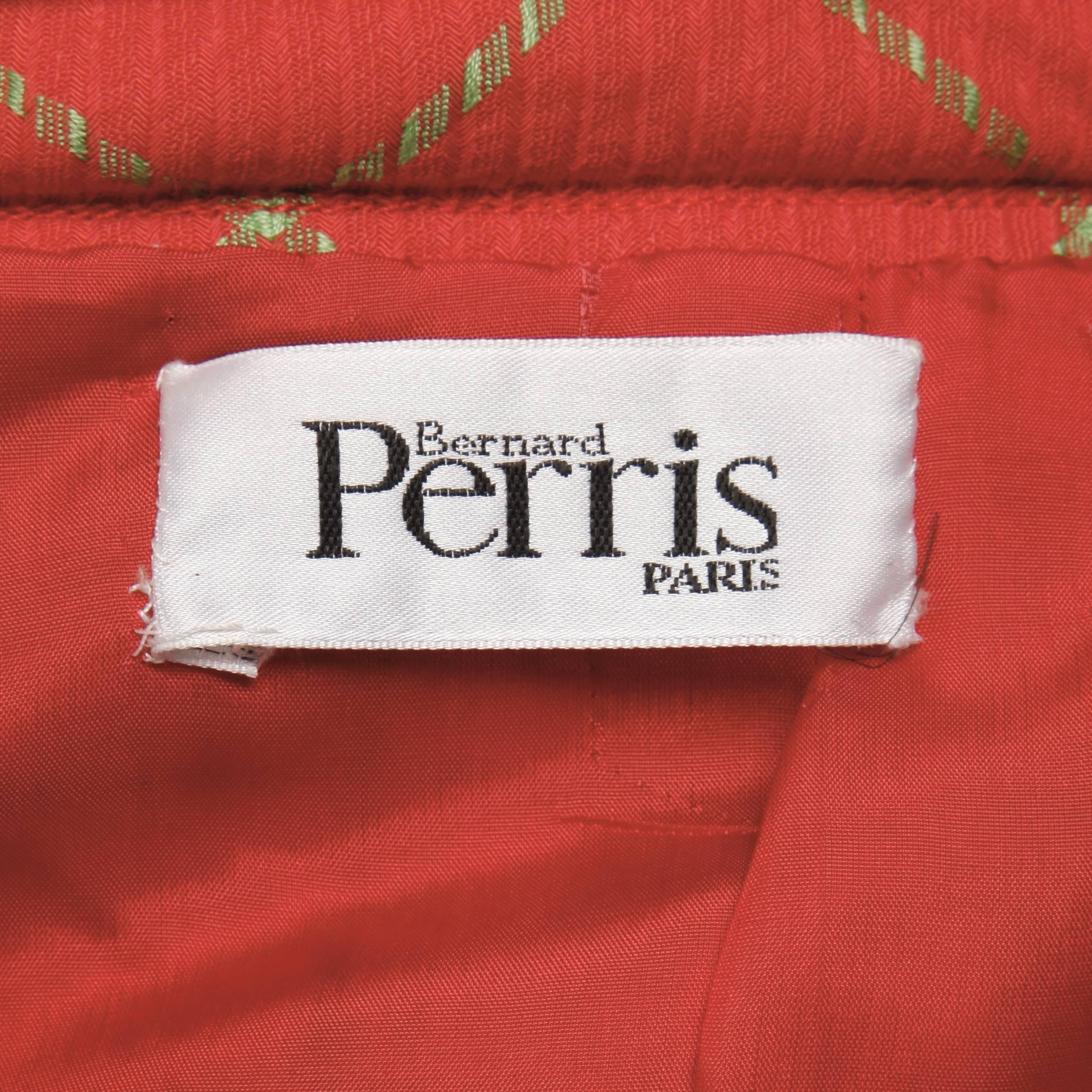 Gorgeous vintage Bernard Perris skirt suit in a coral red and pale celery green plaid. Fabric feels like a cashmere/ wool blend. Fully lined with front zip closure on jacket and rear zip and button closure on skirt. Structured shoulder pads are sewn
