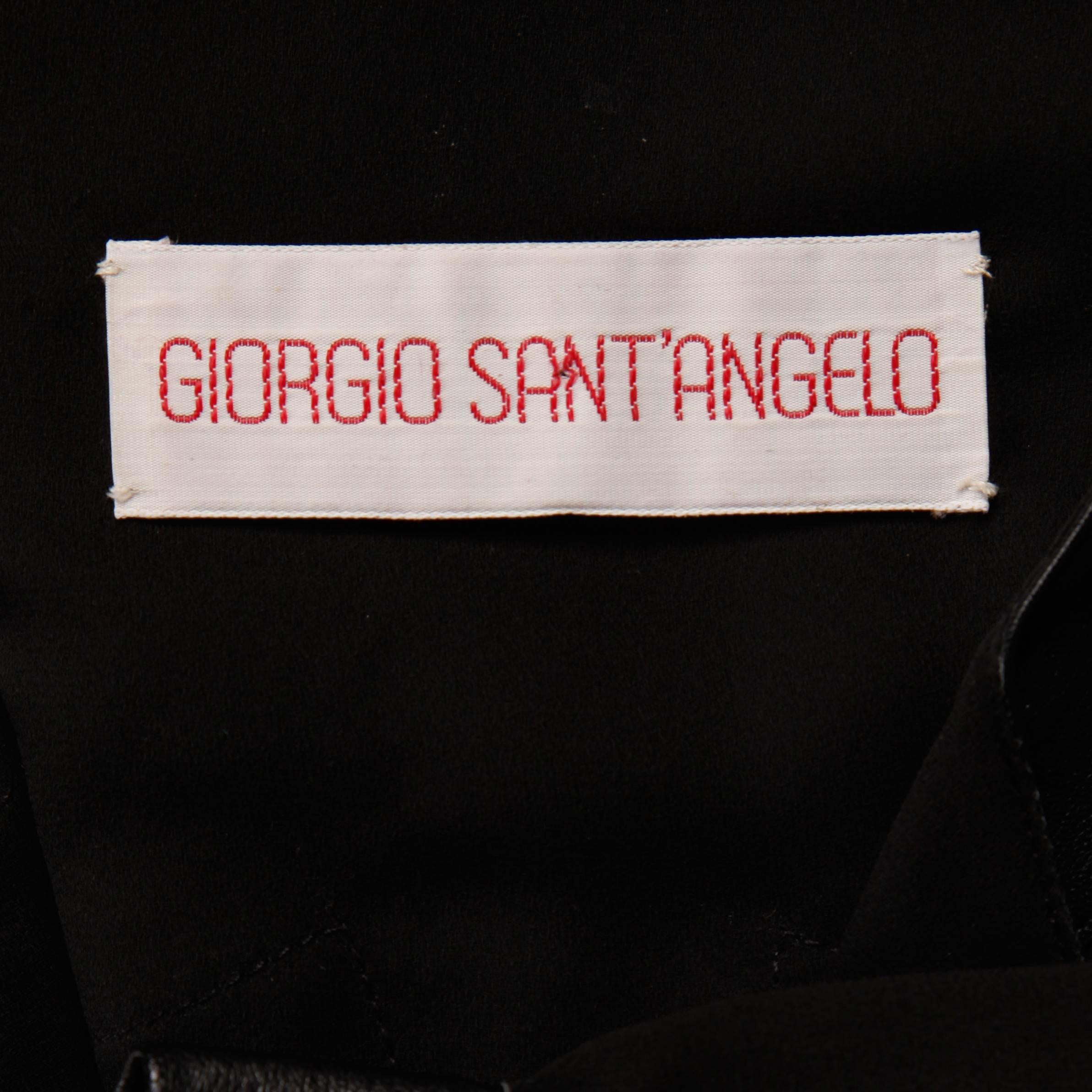 Slightly sheer button up blouse with black leather patchwork detail by Giorgio Sant'Angelo. Unlined with front snap closure. Fits like a modern size small-medium. The bust measures 40", waist 40", hips 41", shoulders 15.5",