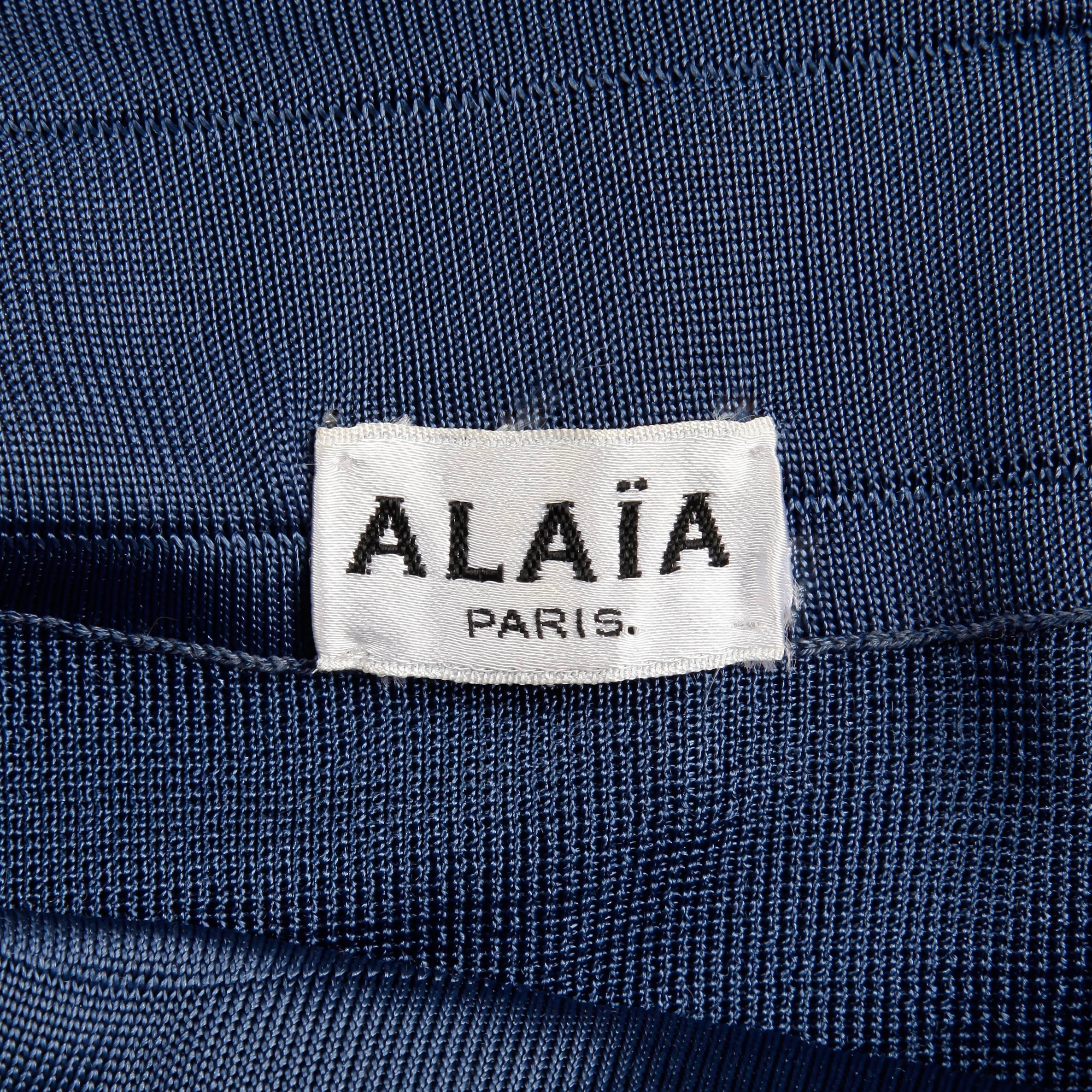 Sexy vintage blue knit mini skirt by Alaia. Unlined with no closure (pulls on over the hips).  The marked size is small. 100% acetate. The waist measures 23-28" (unstretched-stretched), hips 35-39" and the total length 17.5".