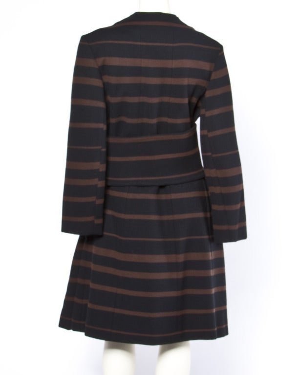 Stunning black and brown striped 100% wool mod coat with removable wide belt. By upscale 7th Avenue New York designer Mam'selle. Gorgeous quality and detailing. Fits like a modern size medium. See measurements below.

Details

Fully Lined
Front