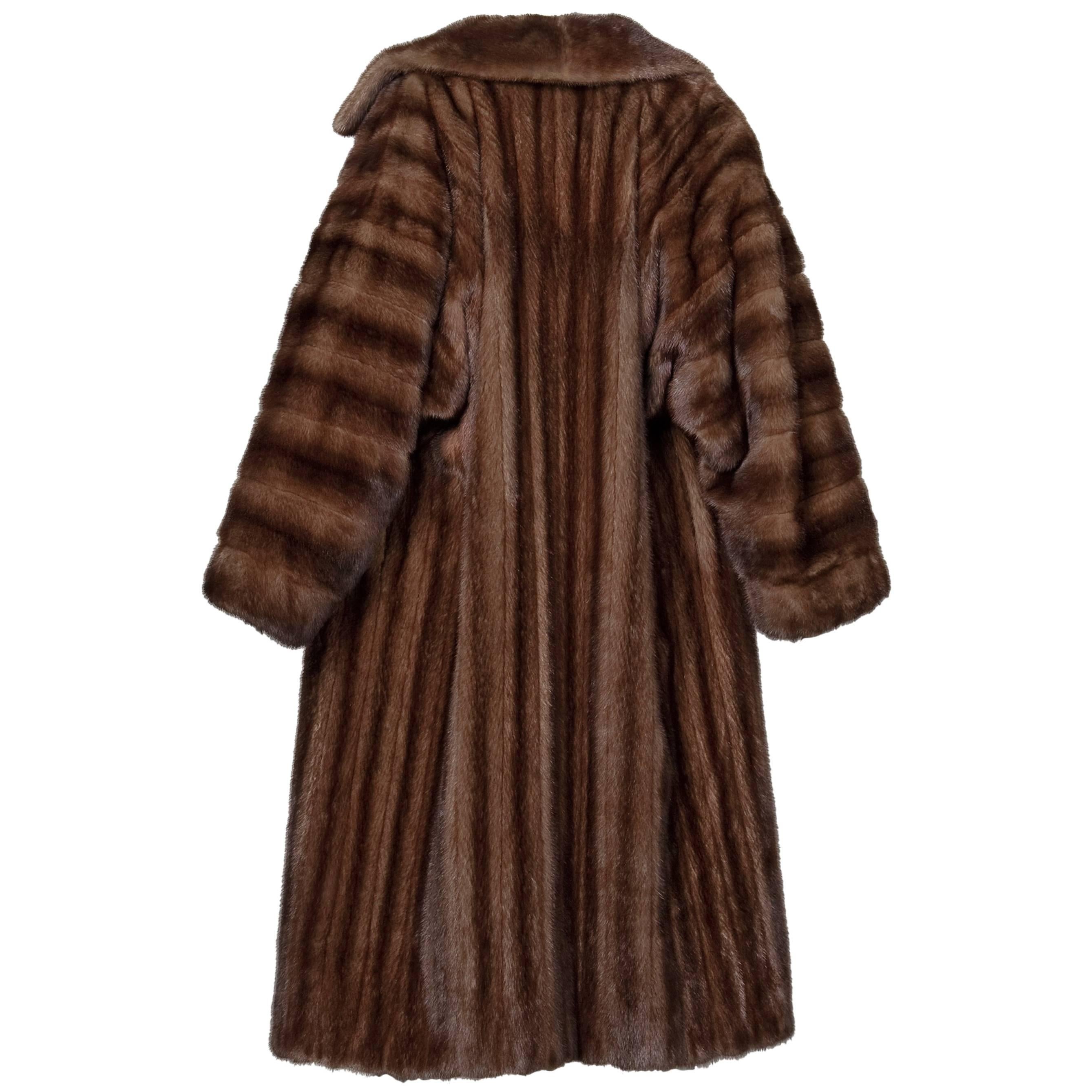 Absolutely spectacular vintage coat by James Galanos for Neiman-Marcus. At the time this was made, Galanos fur was the most expensive fur sold in the US.  Stunning mahogany female mink fur is in excellent condition and was always stored in cold