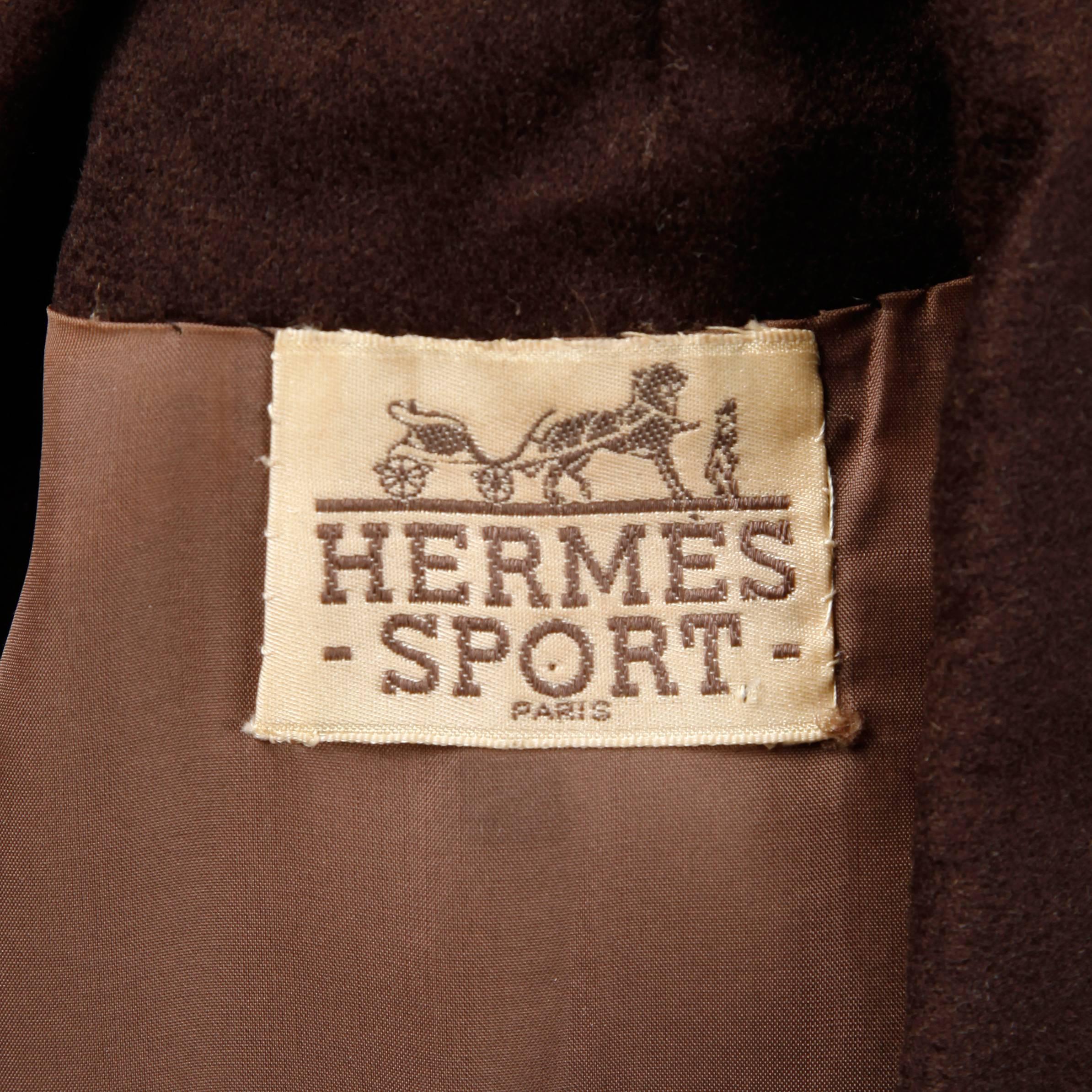 Absolutely stunning vintage coat dress by Hermes Sport in what feels like a chocolate brown cashmere (fabric content is unmarked). Couture hand stitched creamy brown silk lining. Flawless construction and matching 