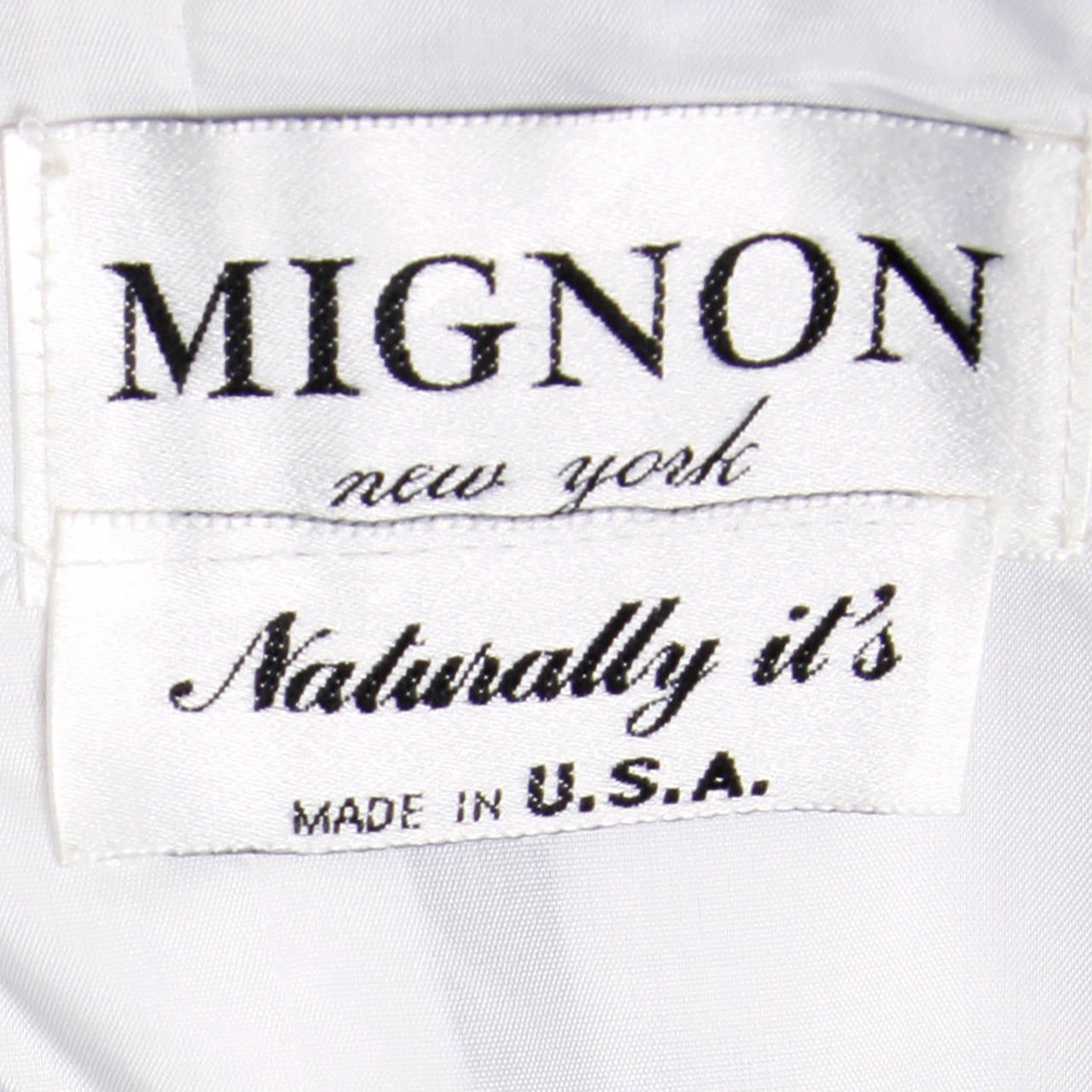 Vintage black and white silk gown with oversized bow and strapless bodice by Mignon. The marked size is 10, but the dress fits more like a modern size medium. The measurements are as follows: Bust: 36