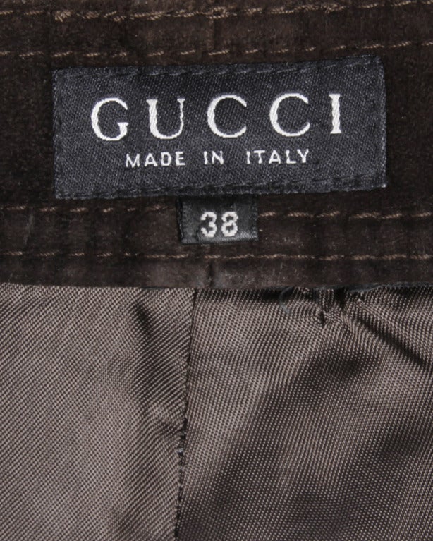 Luxurious soft brown suede leather vintage high waisted pants by Gucci. Traditional 5 pocket design with embroidered Gucci logos on both back pockets. Fully lined with front zip and button closure. Fits like a modern size XS. The measurements are as
