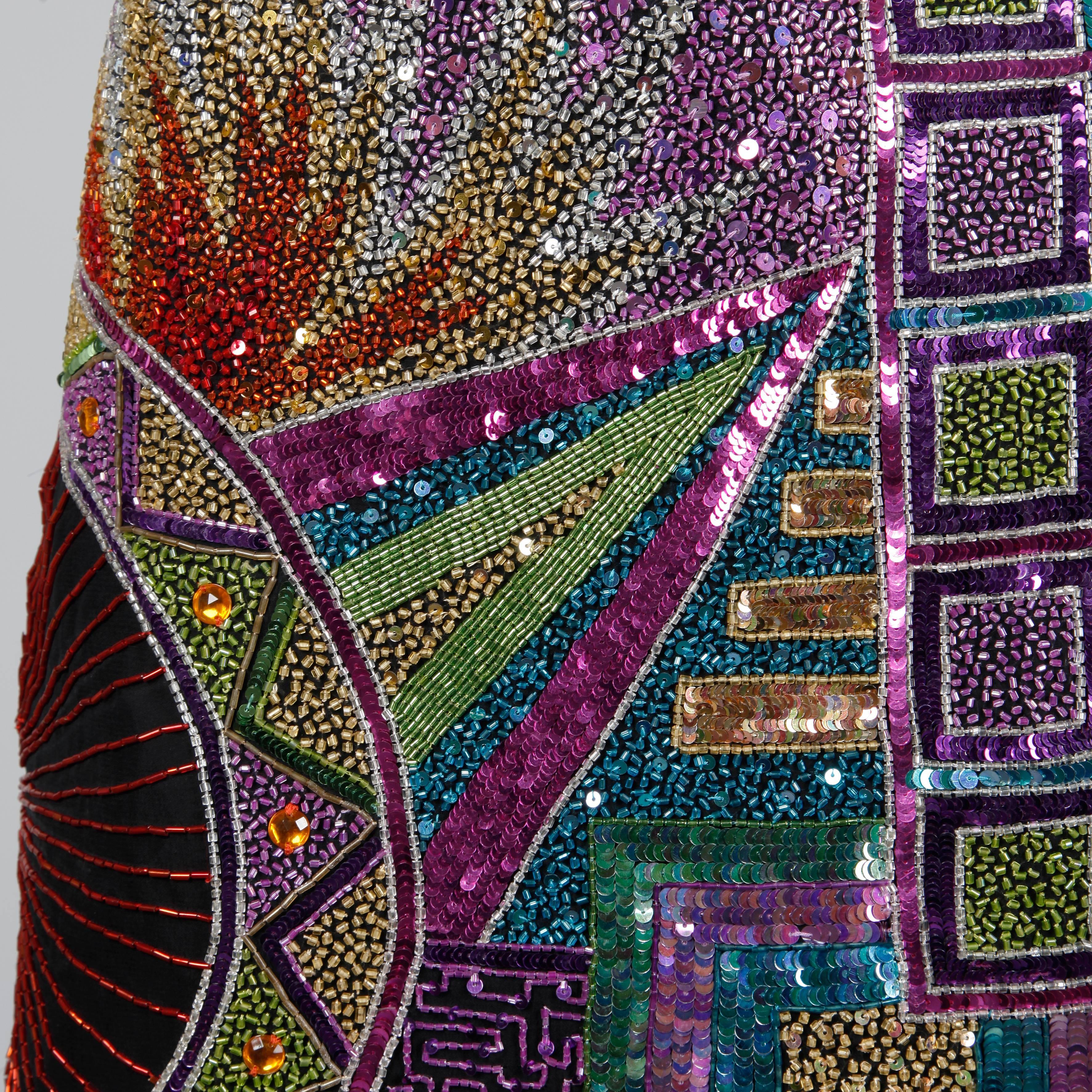Incredible vintage Naeem Khan silk dress encrusted with thousands of tiny sparkling sequins and beads. This dress is HEAVY! Fully lined with rear zip and hook closure. Structured shoulder pads can easily be removed if desired. 100% pure silk. The