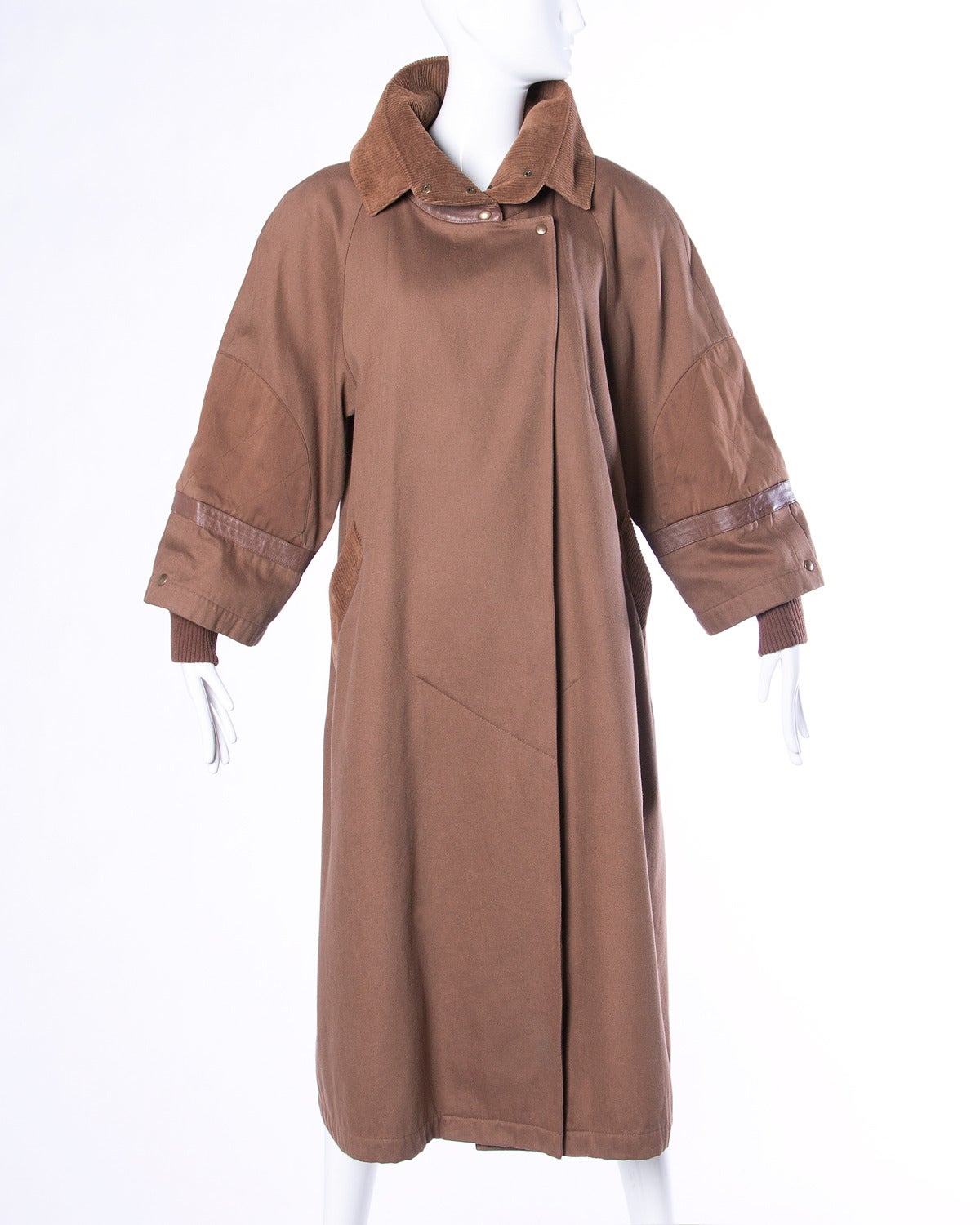 Reduced from $895. Unique avant garde coat by Claude Montana. Snap detail up the back of the coat and buttery leather trim with buckle detailing. Please see measurements below.

Details:

Partially Lined
Side Pockets
Front and Back Snap