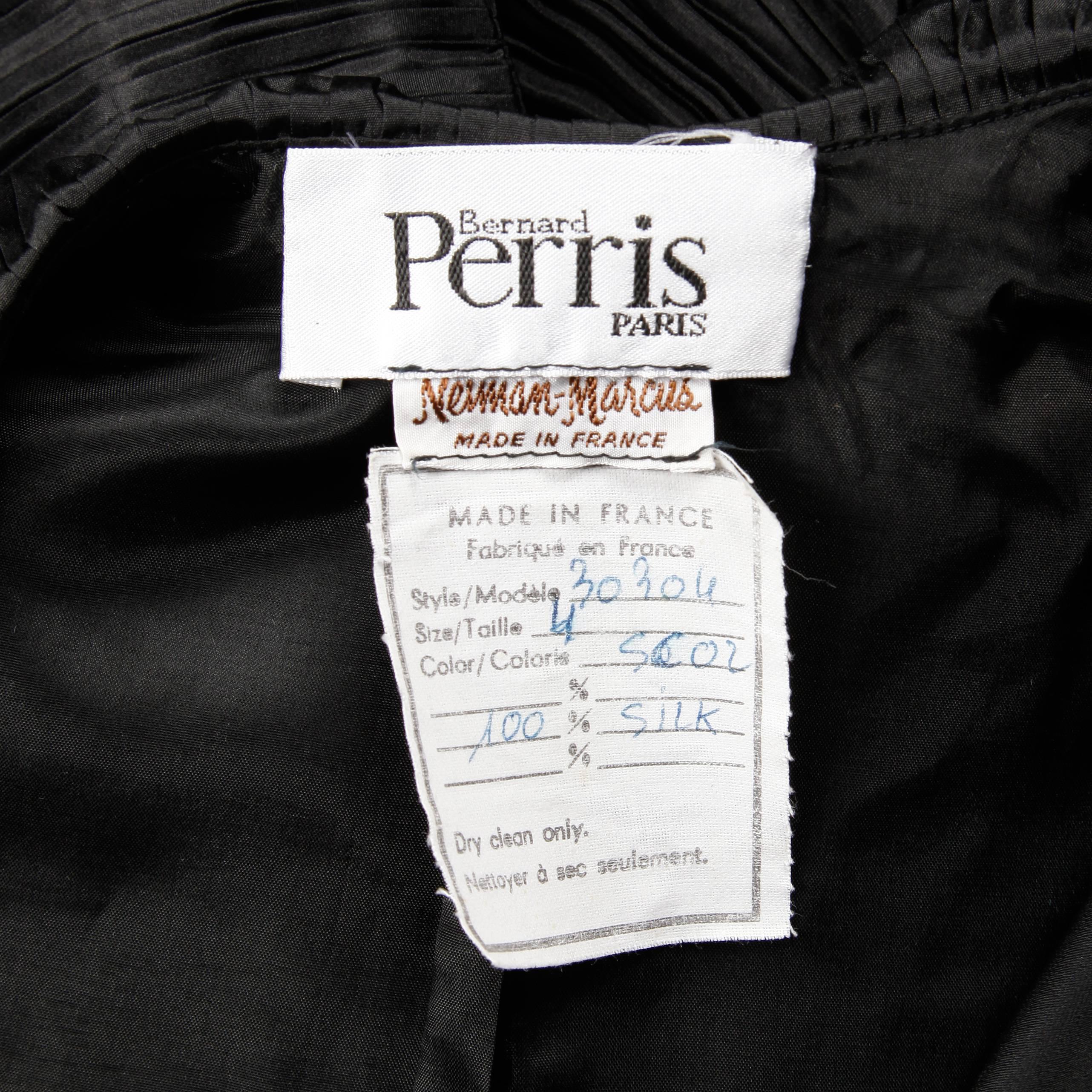 Truly unique vintage pleated silk black tuxedo jacket by Bernard Perris with amazing construction! Fully lined with front button closure. 100% silk. The marked size is 4, and the jacket fits like an XS. The bust measures 33