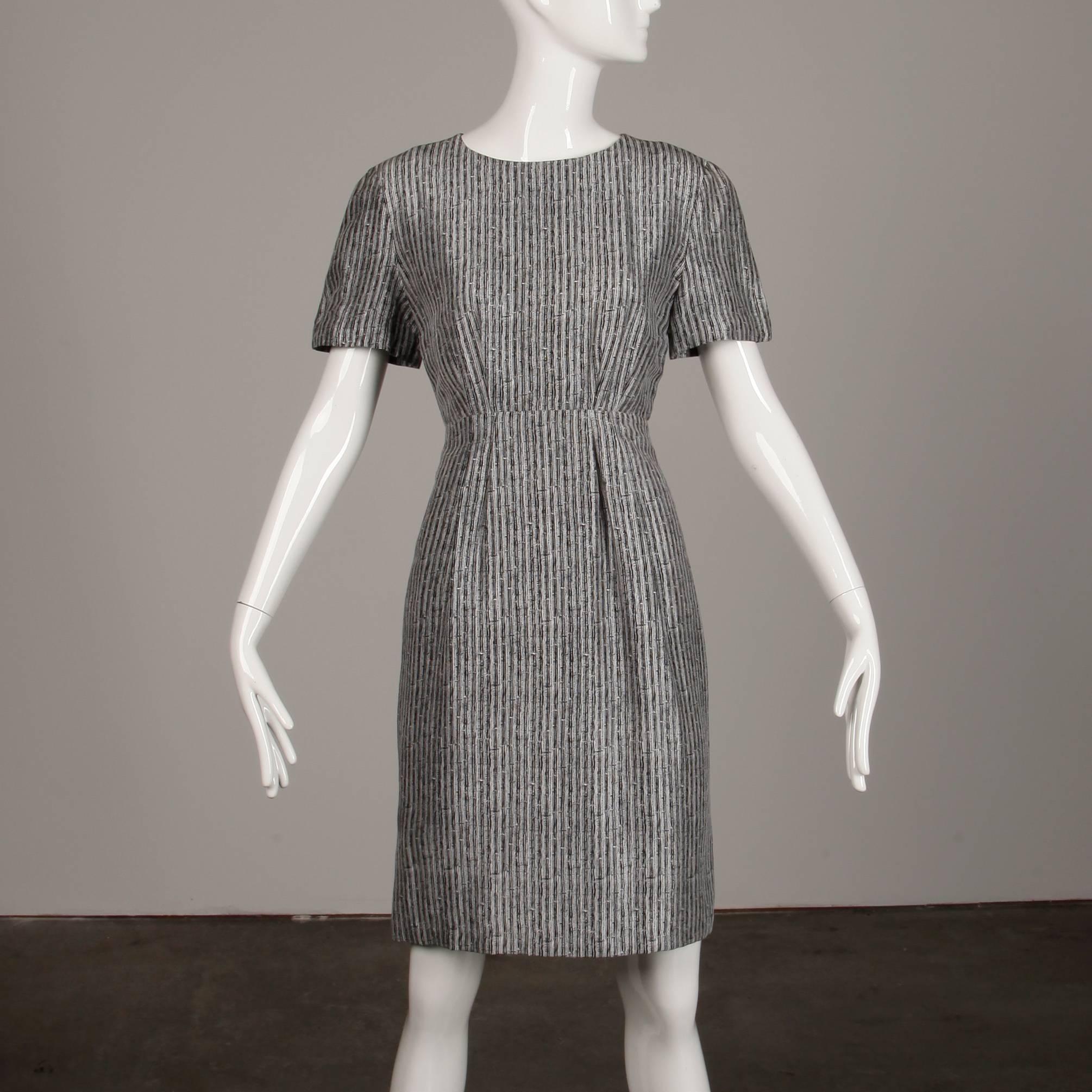 Simple and chic vintage silk sheath dress by Adele Simpson with a black and white print. Fully lined with rear zip closure. The marked size is 6, and the dress fits true to size. 100% silk. The bust measures 36