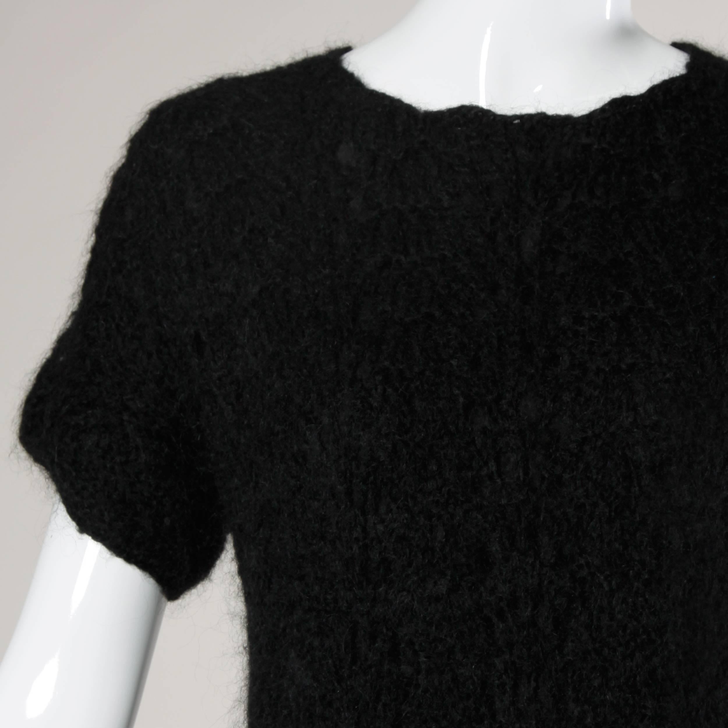 Hand crocheted Italian wool dress by Macy Associates.

Details:

Fully Lined
No Closure/ Fabric Contains Stretch
Marked Size: 12
Estimated Size: M
Color: Black
Fabric: Not Marked
Label: Macy Associates

Measurements:

Shoulders: