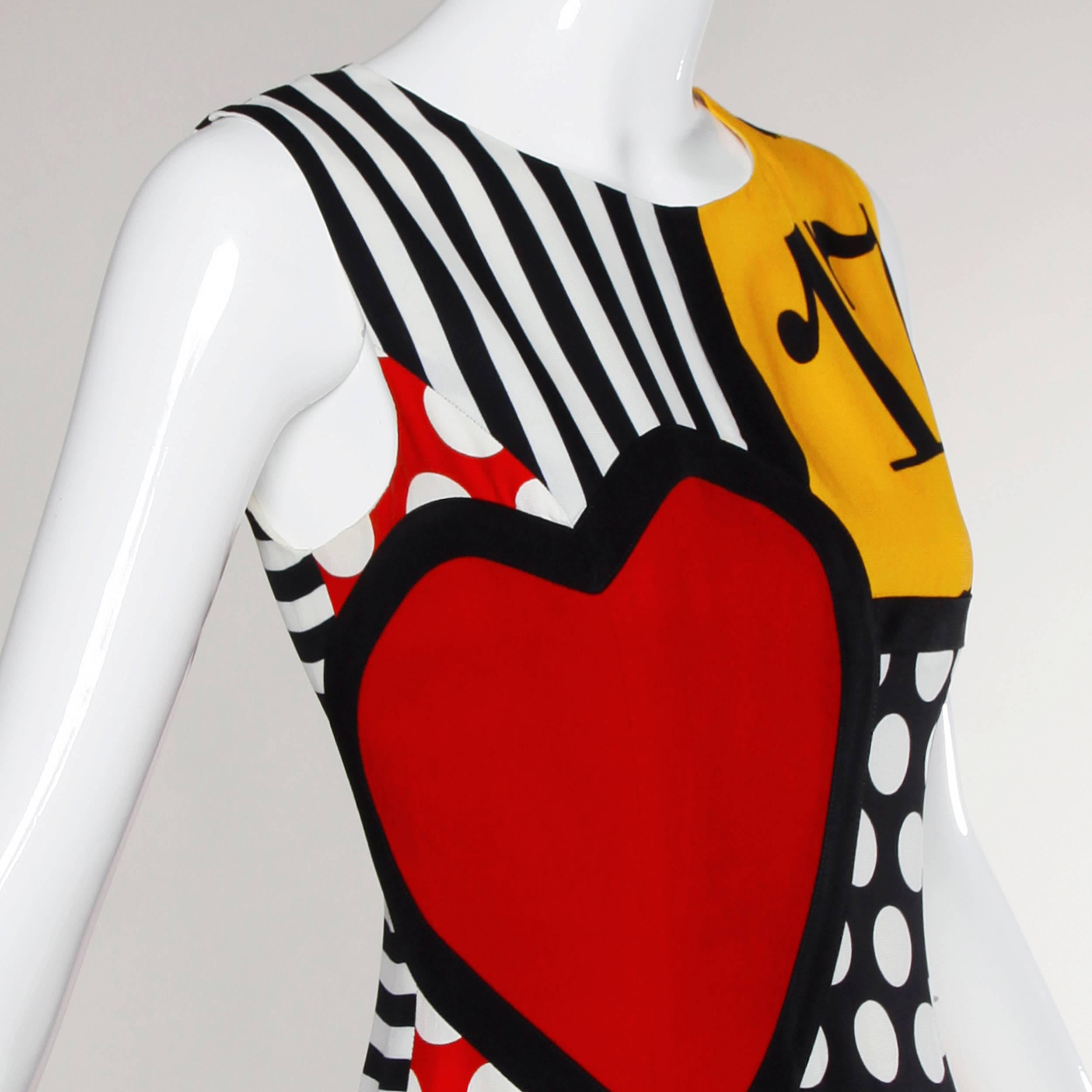 Reduced from $950! Iconic vintage Moschino dress with a vibrant pop art design which features numbers, polka dots, stripes, a heart, black cats and horseshoe design. 

Details:

Fully Lined
Back Zip Closure
Marked Size: I 42/ US 8/ D 38/ F 38/