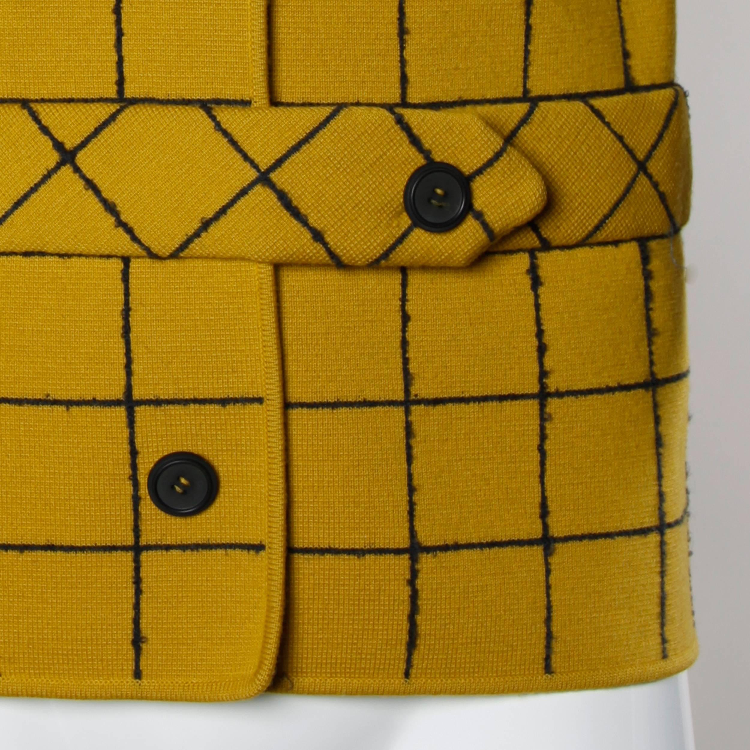 Mustard yellow Italian wool knit sweater jacket by Gino Paoli. Mod windowpane design with button up front.

Details:

Unlined
Front Pockets
Front Button Closure
Marked Size: US 8
Estimated Size: S-M
Color: Mustard 
Fabric: 100%