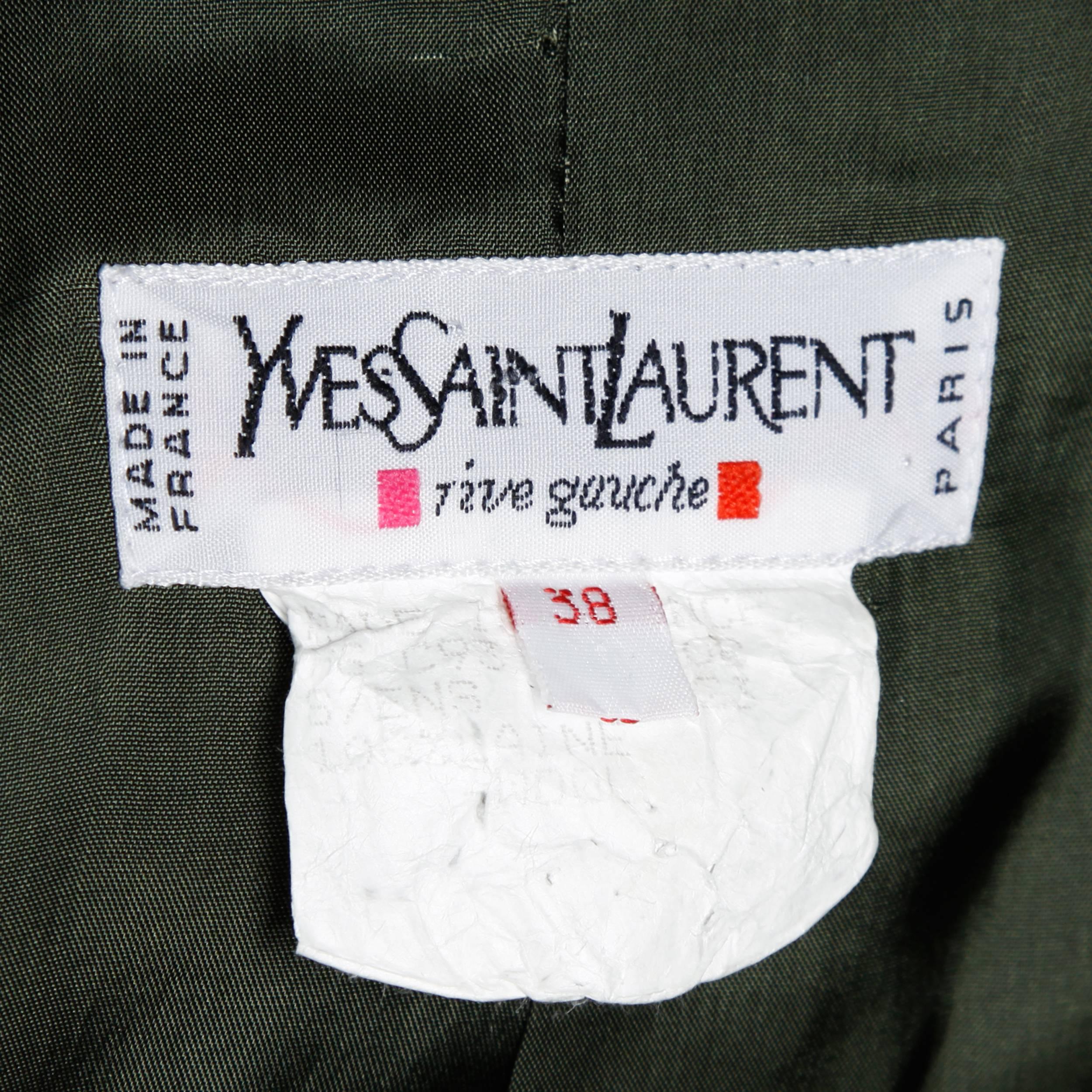 Rich dark green wool blazer by Yves Saint Laurent Rive Gauche. Oversized wooden buttons and pristine tailoring.

Details:

Fully Lined
Front Pockets
Shoulder Pads Sewn Into Lining
Front Button Closure
Marked Size: IT 38
Estimated Size: