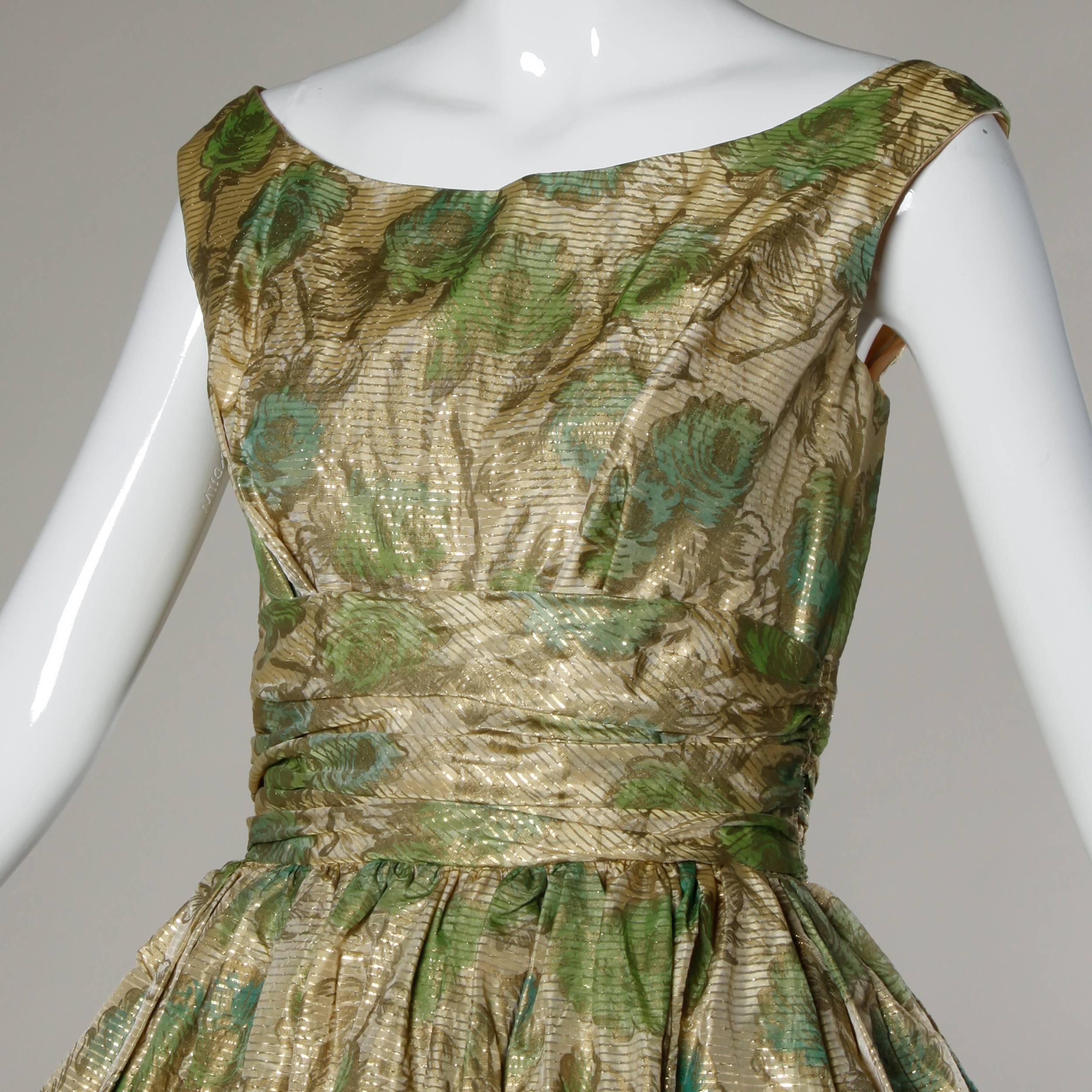 Unworn with the original tags still attached! Vintage 1950s cocktail dress in a metallic floral print. Bubble hem with built in crinoline adds extra volume to the skirt of the dress.

Details:

Fully Lined
Back Metal Zip and Hook