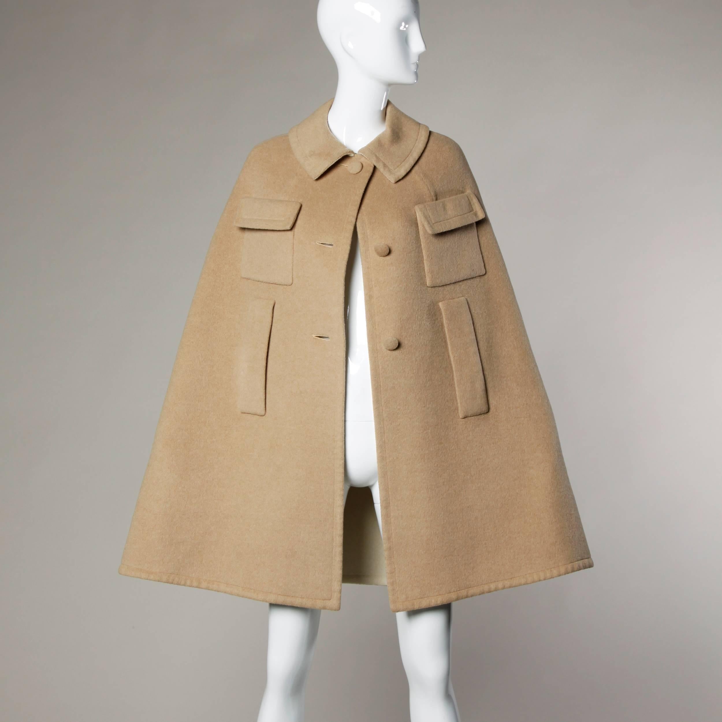 Stunning vintage camel cape coat in a soft luxurious cashmere and wool blend. Reversible construction (except for the labels) indicate that this cape was also intended to be worn with the cream side showing. Very pretty high quality fabric! Made in