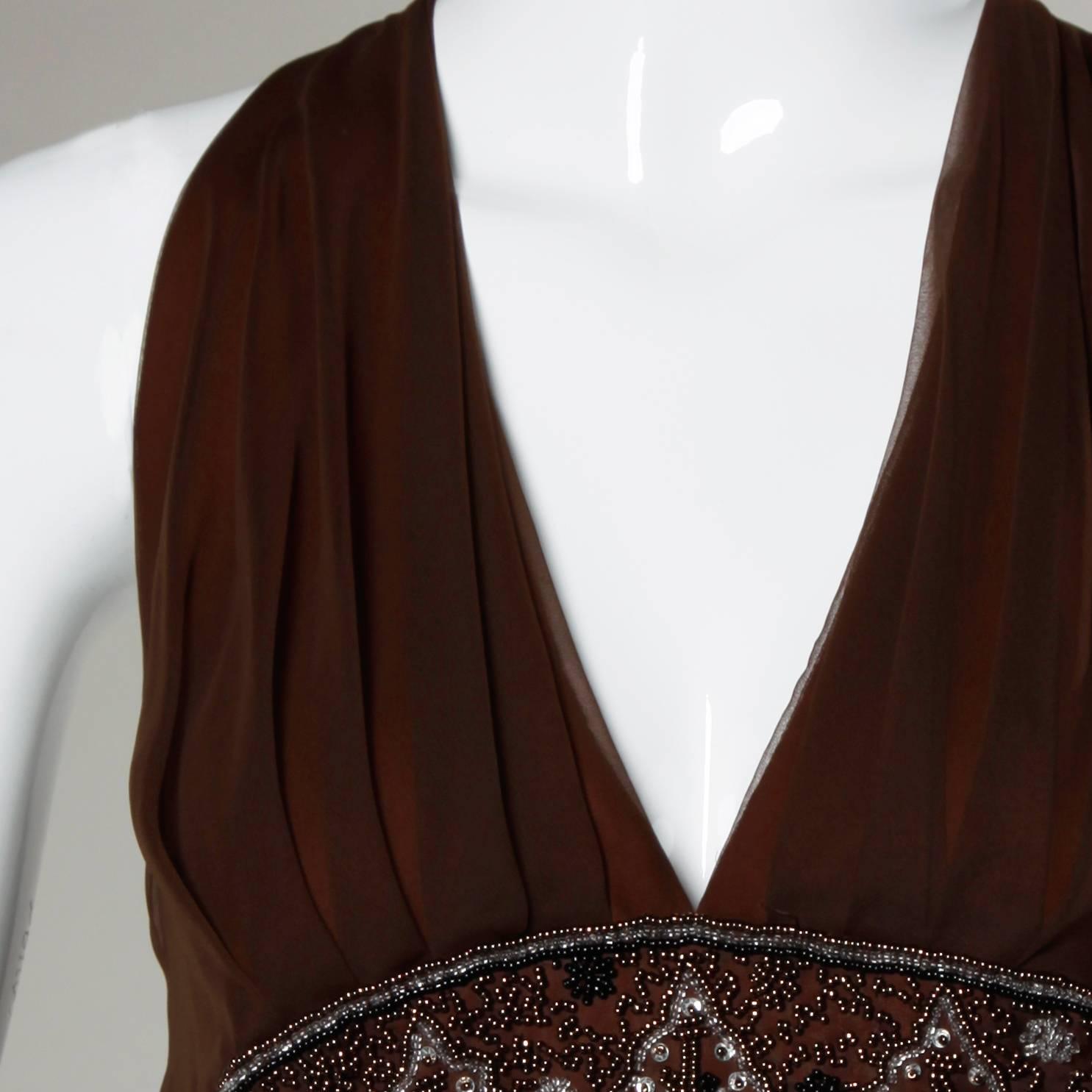 Brown chiffon maxi dress with a beaded empire waist and plunging neckline by Jack Bryan. Full sweep.

Details:

Fully Lined
Back Zip and Hook Closure
Marked Size: US 14
Estimated Size: M-L
Color: Transparent Brown/ Burnt Orange 
Fabric: Not