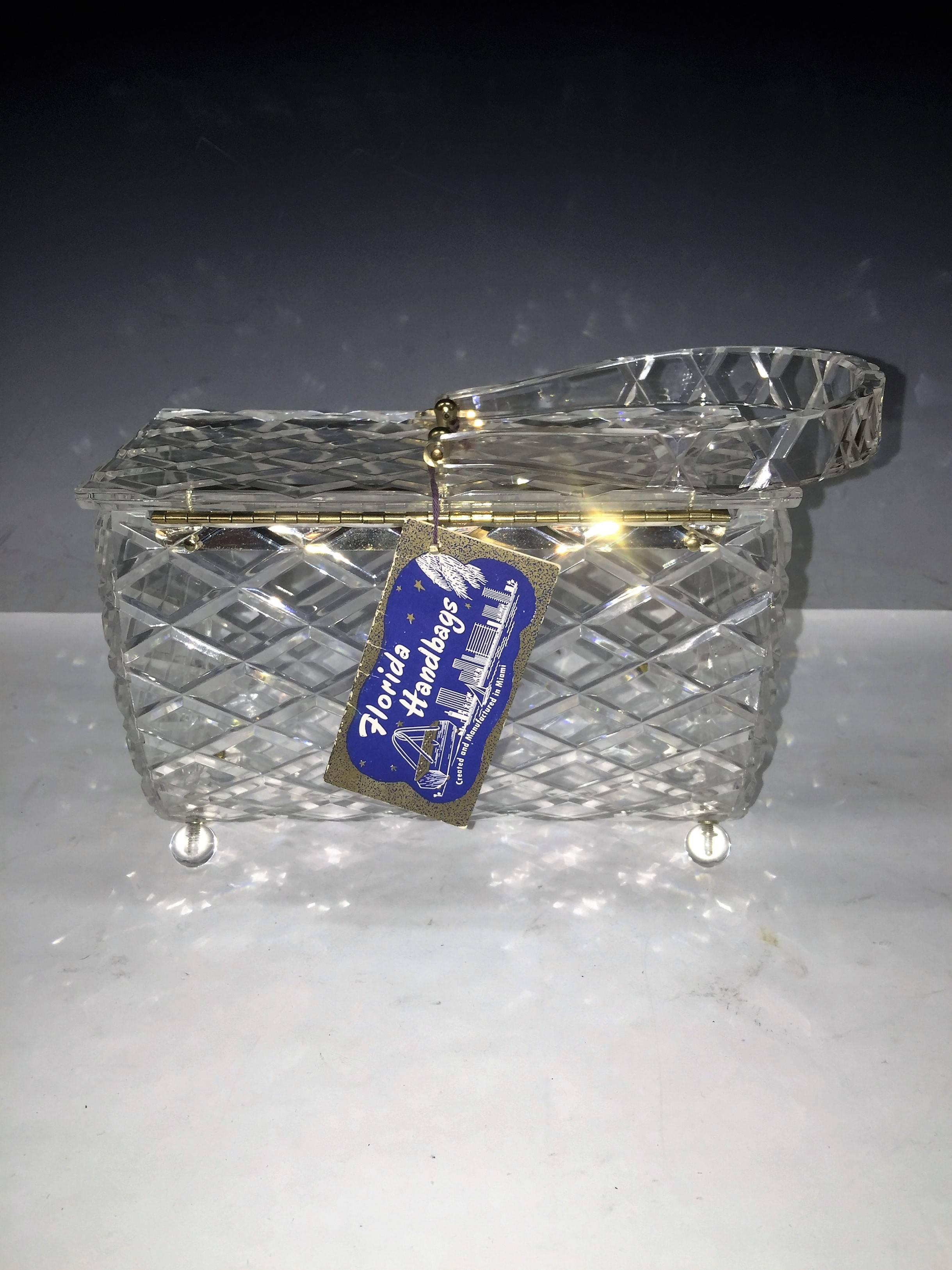 Mint Condition Never Used Large Lucite Handbag with Original Tag that reads Florida Handbags.Fantastic Style and Design of a Thick hand Carved Clear Lucite Handbag with Beautiful Side Attached Handle.Great Geometric Diamond Design on this