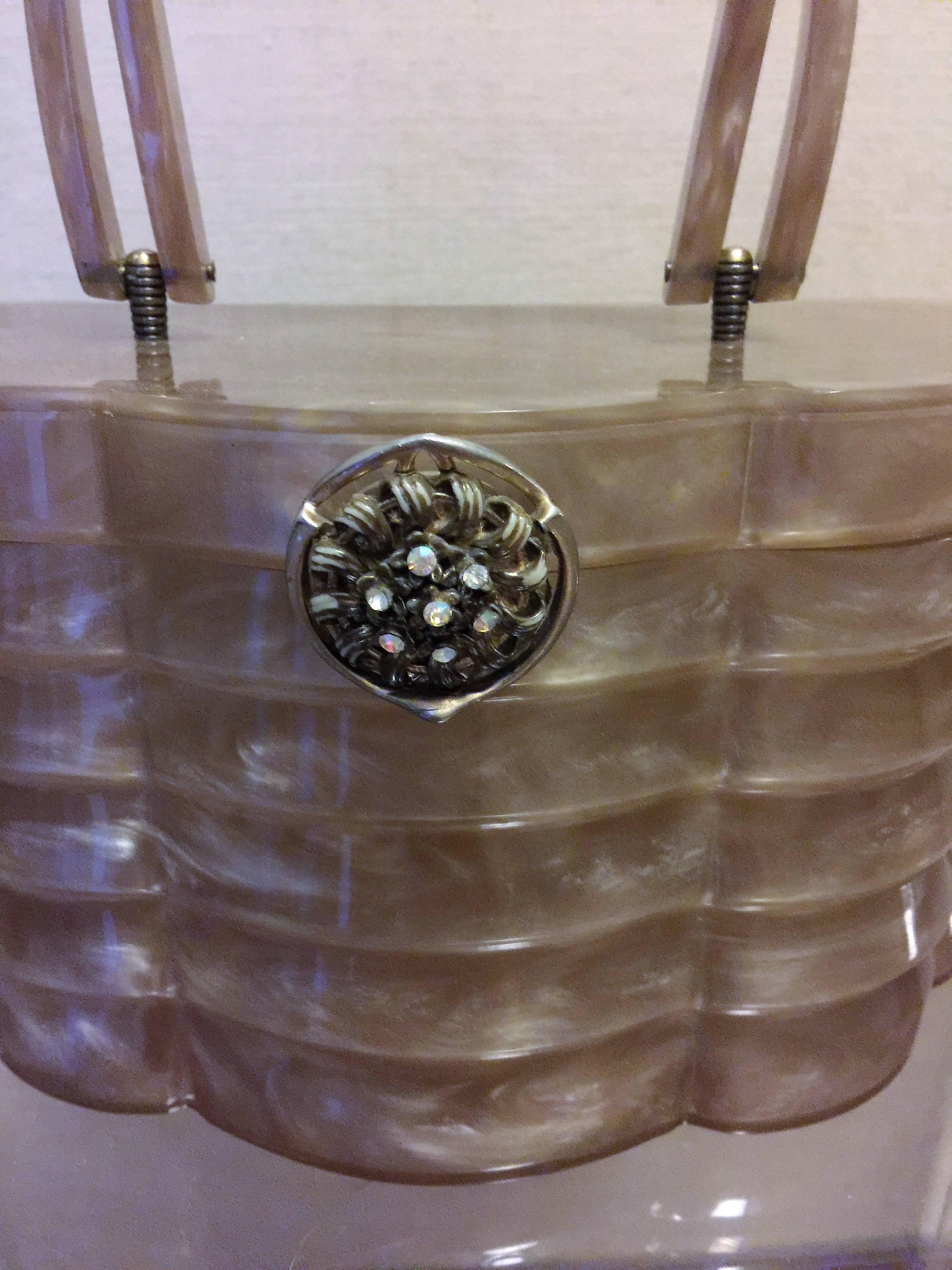 Fantastic Shaped Deep Champagne Color Wilardy Lucite Handbag.This High End Amazing Lucite Handbag is a Real Show Stopper all Hand Formed by Master Lucite Handbag Designer Wilardy.Set with a Beautiful Rhinestone Clasp this is a Great 1950's Lucite