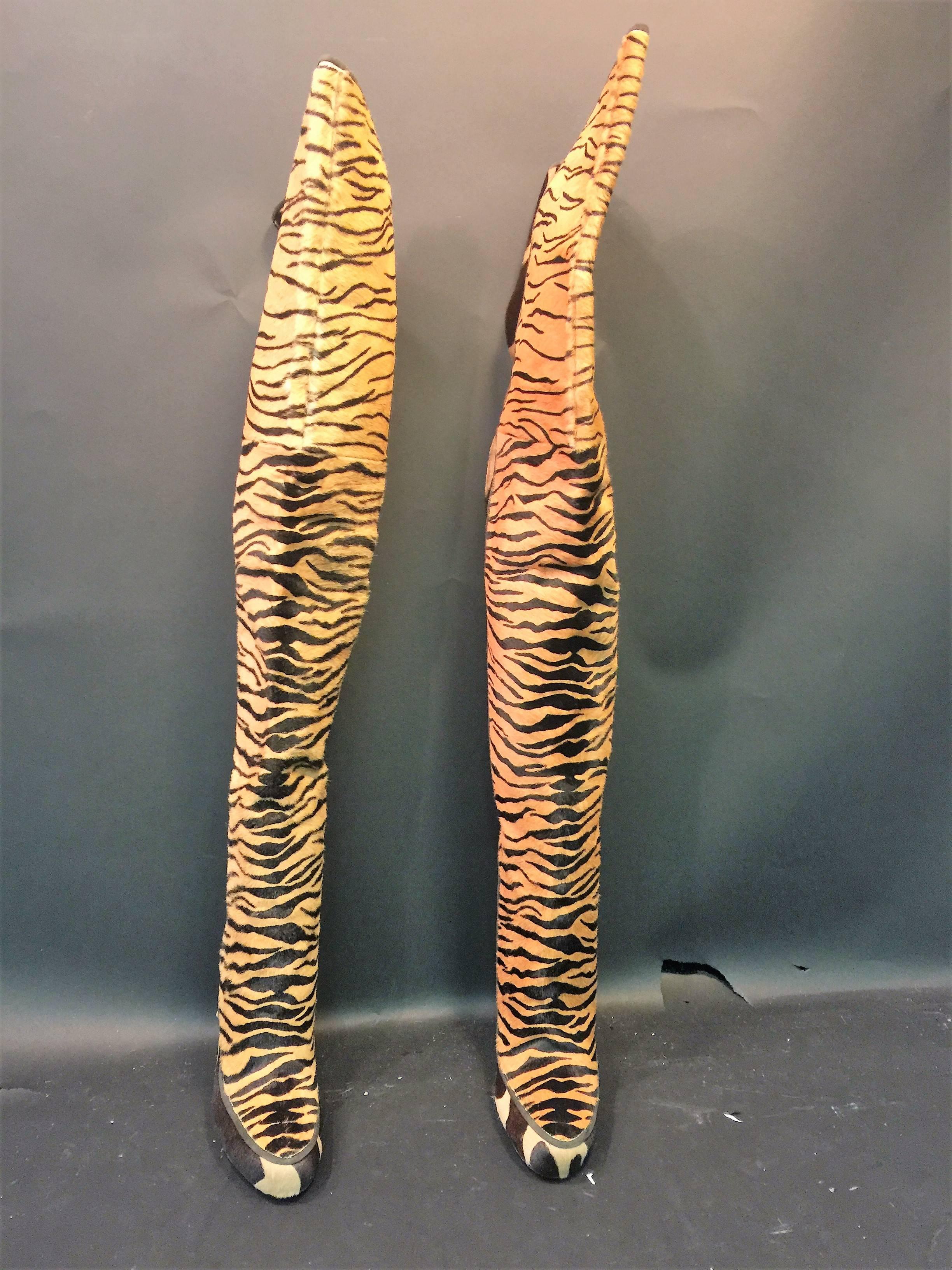 Amazingly Sexy Thigh High Boots Designed By Roberto Cavalli in Italy.These Incredible Black Stiletto Heel Boots are Patterned with Tiger Stripes and Giraffe Spots on Fur Hide.Lined in Luxe Chocolate Leather these were never worn and are a U.S. Size 9