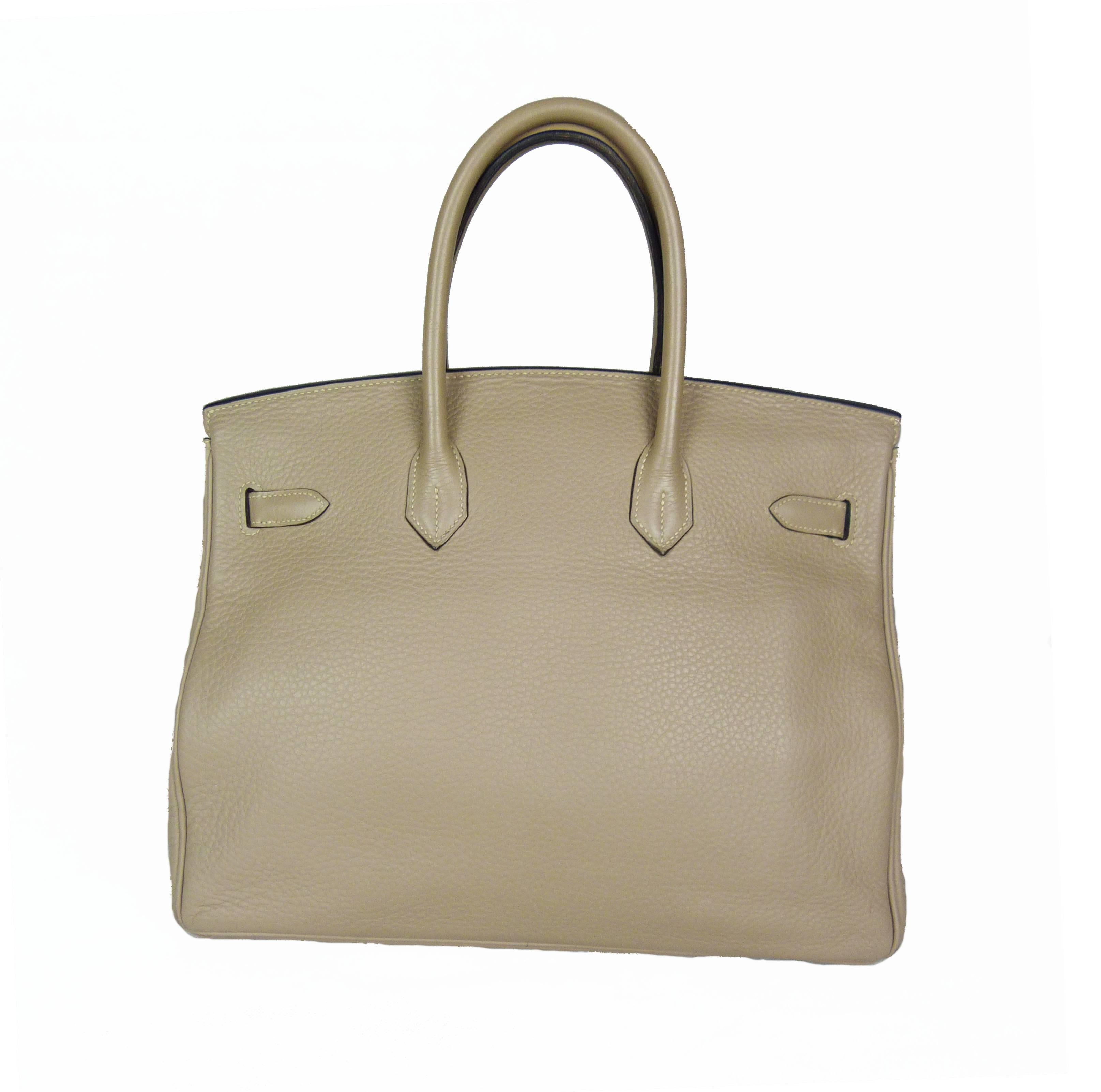 Hermès Birkin 35Cm Gris Tourterelle Clémence,
The bag comes in a beautiful and unique Grey Tourterelle and is finished with silver hardware. 

Year 2003. 
This bag comes with lock, keys, clochette.
Good condition, 

States of corners :