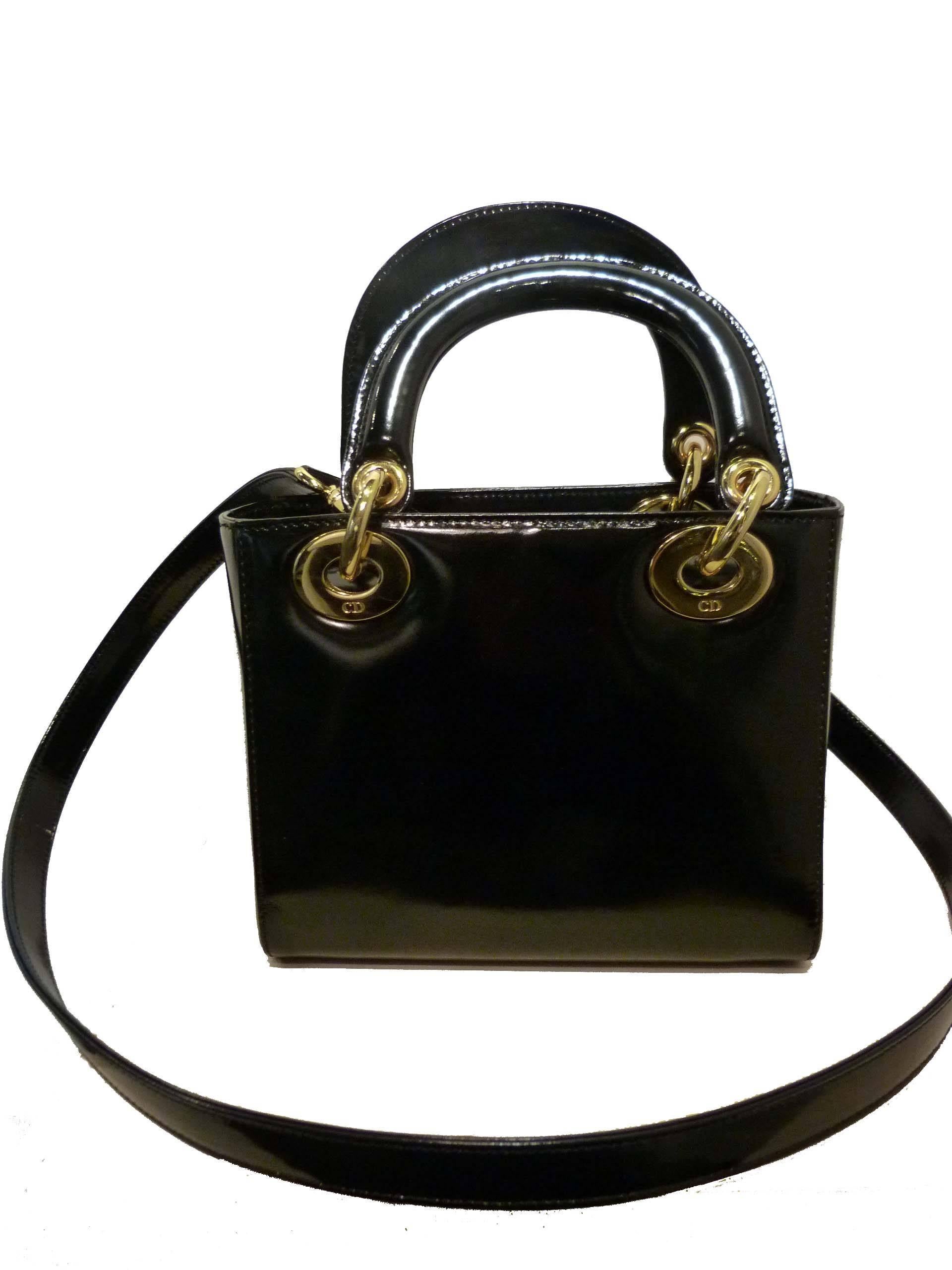 Bag Mini Lady Dior black patent leather, handle joined, shoulder strap, metal side gilded. 
Purse material : patent leather. 
Color : black. 
State : Really good condition. 
Season : fall/winter. 
External condition : Very good, very small