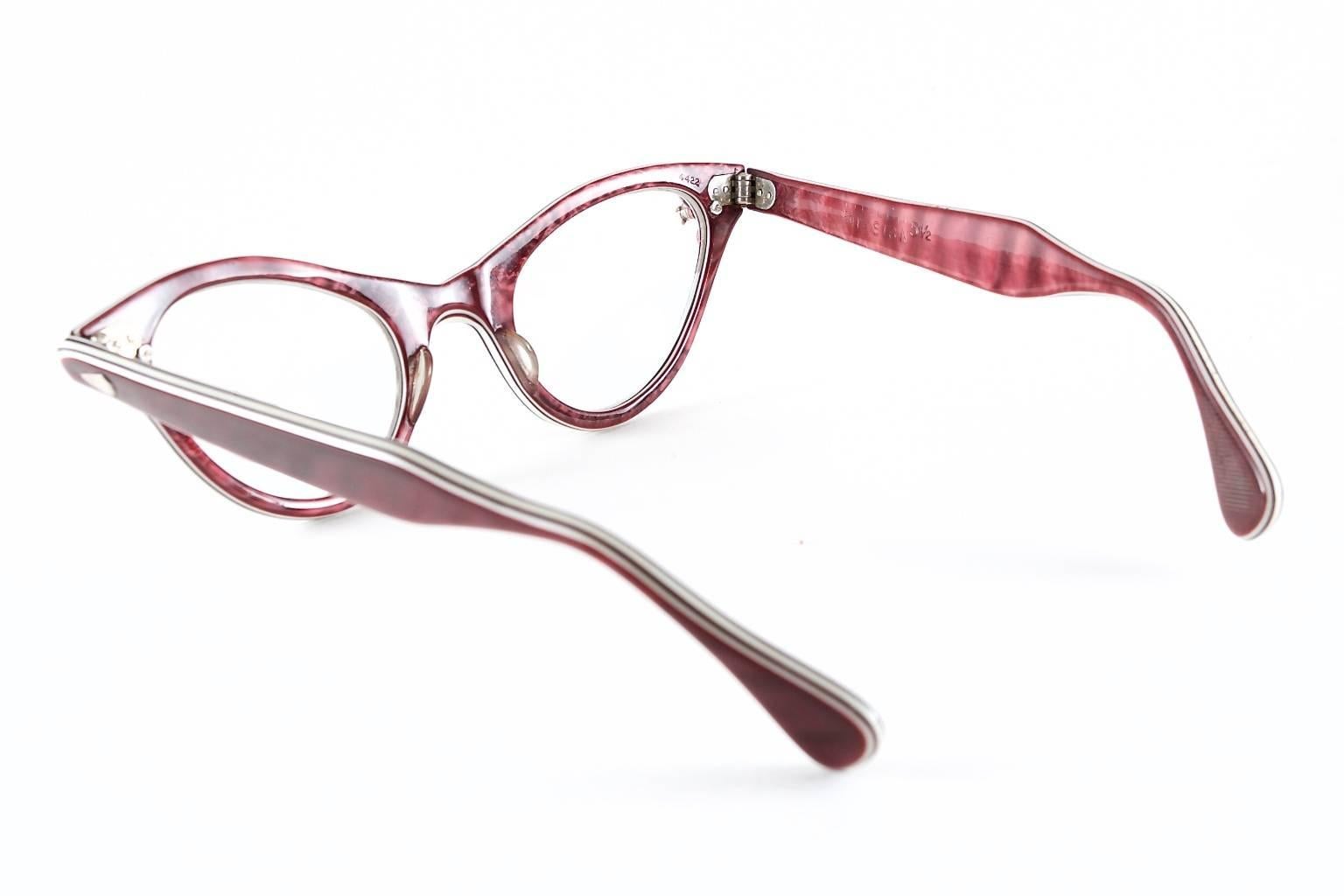 1950's cat eye glasses in plum featuring copper and cream flora pearl accents.

_____________________________________________________________
Established in 2005, Hotel de Ville is the premier destination in Los Angeles for vintage and modern