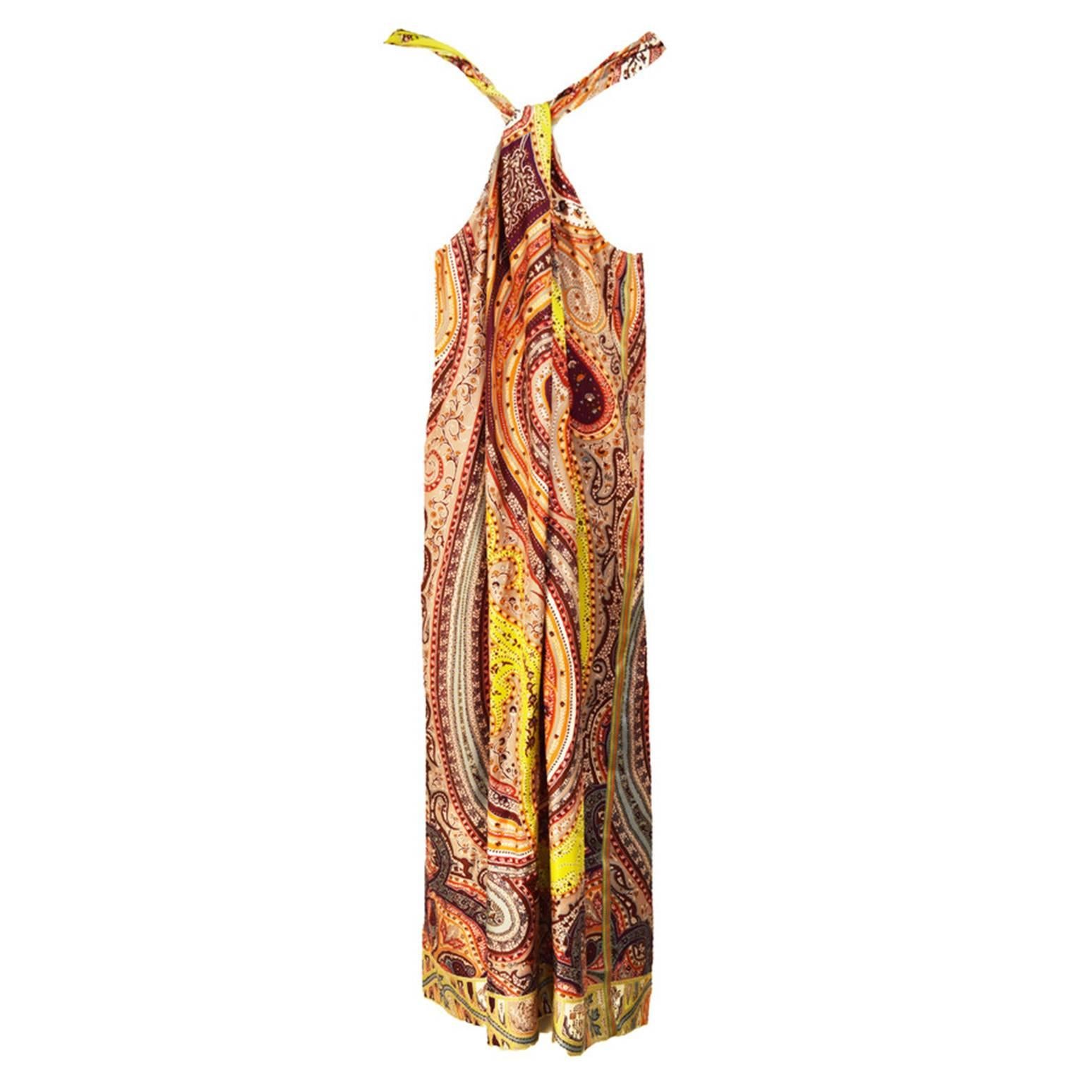 With this classic paisley print, this dress is perfect if you like Etro. This multi colored silk dress is a wrap-like dress and is below the knee. Knotted Back. Great for a summer wedding or resort destinations. 