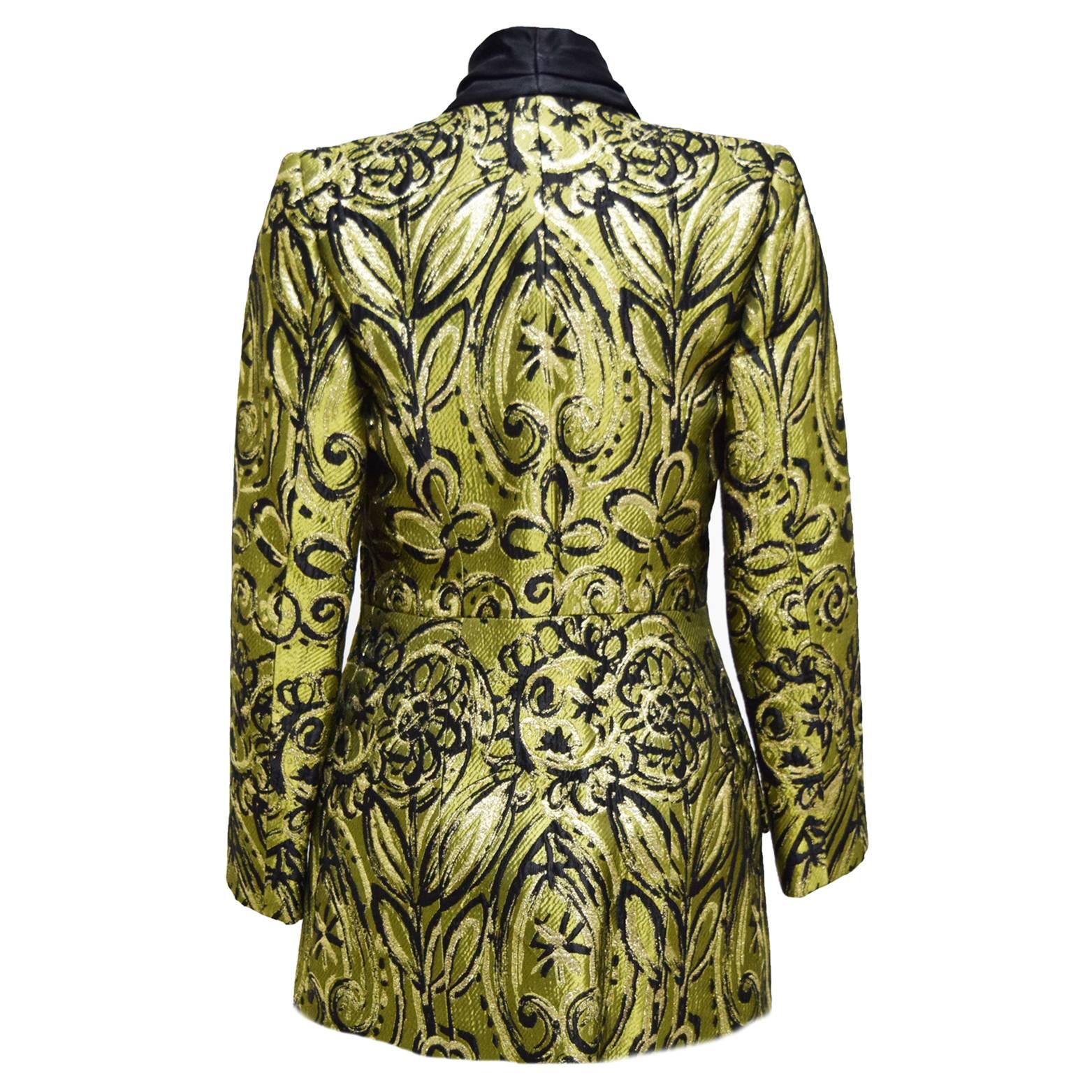 This fabulous Christian La croix two piece is mixed with olive green, metallic gold, black, and grey abstract floral print. The neck is covered in rich black satin for a amazing contrast. The Jacket part of the suit has two snap closures and a main