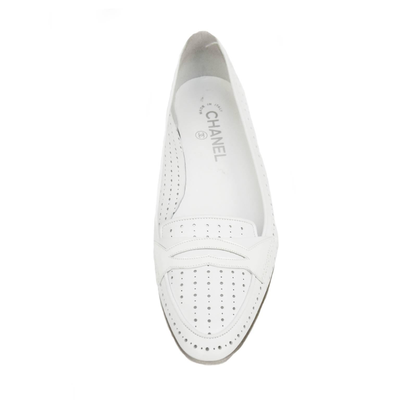 These Chanel loafers are the exact image Coco Chanel herself wanted to portray, casual style and comfort. These shoes are made with white leather and have small cut out circles to create a polkadot effect. The back piece of the loafer has the Chanel