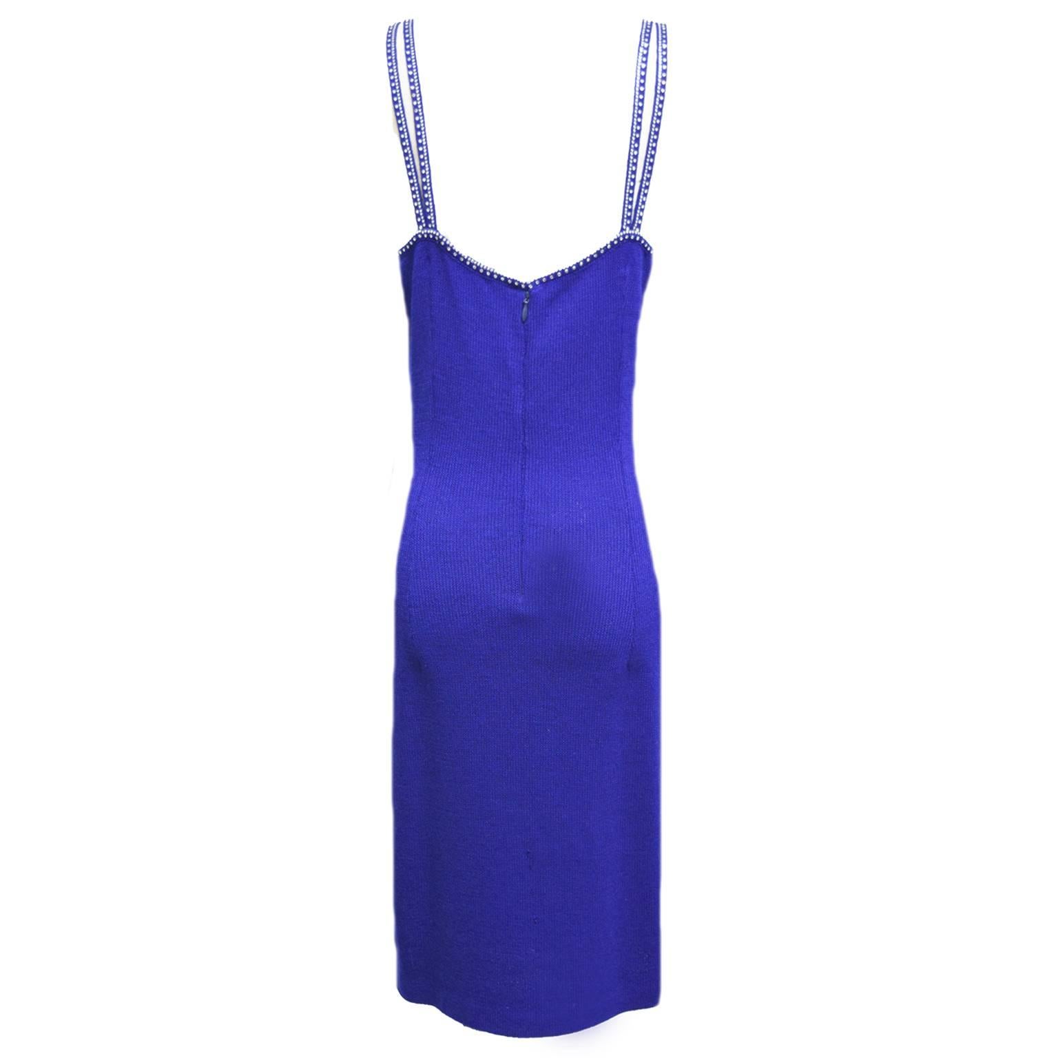 St. John evening wear is great for any night out. This bodycon dress is royal blue with two strapped upper and has a rhinestone boarder along the straps and neckline.   
