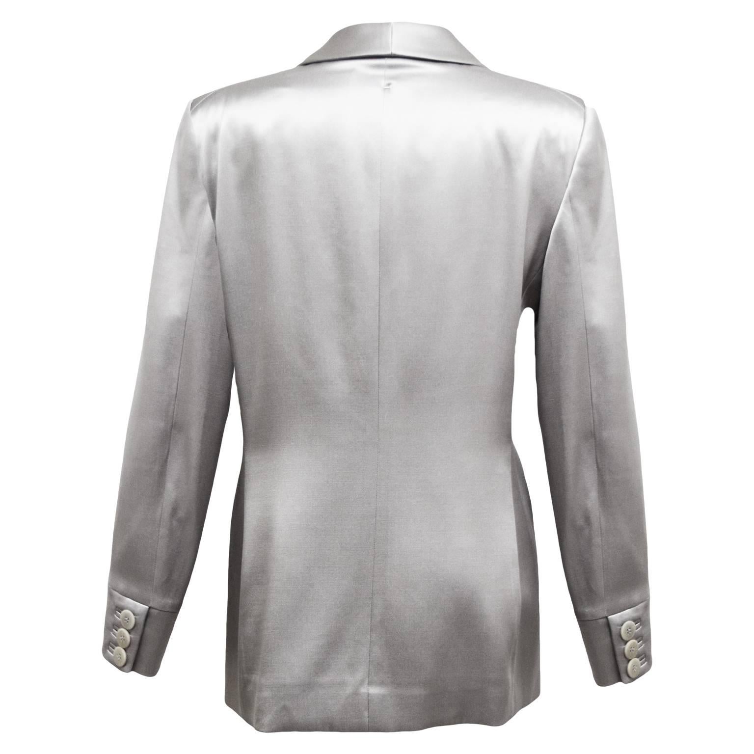 This Giorgio Armani tuxedo blazer is made out of 100% grey metallic silk and is single breasted, with pockets, and is fully lined.