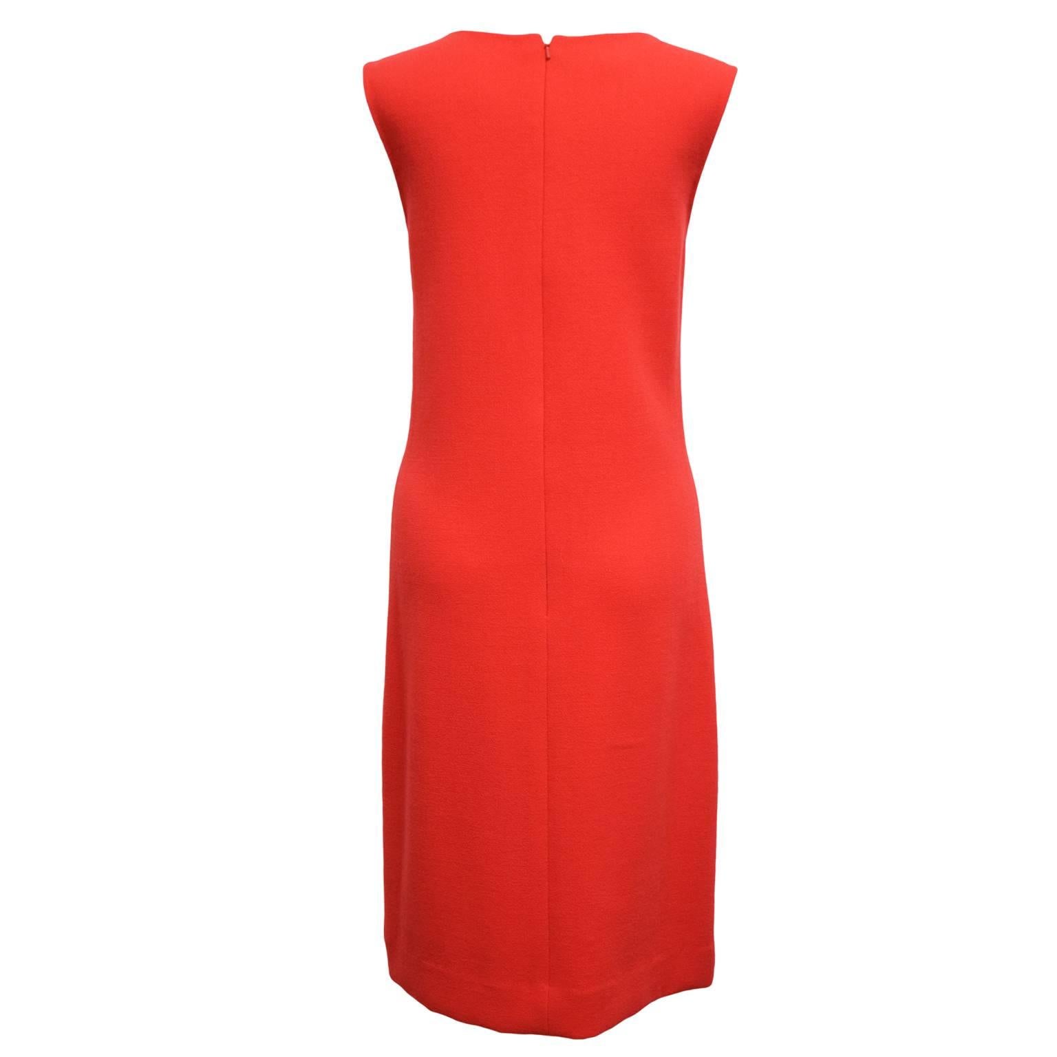 This Oscar de la Renta dress is a sexy beautiful red wool and silk blend, and has patchwork front detailing with Eyelash fringe for contrast and geometry. Fully lined.