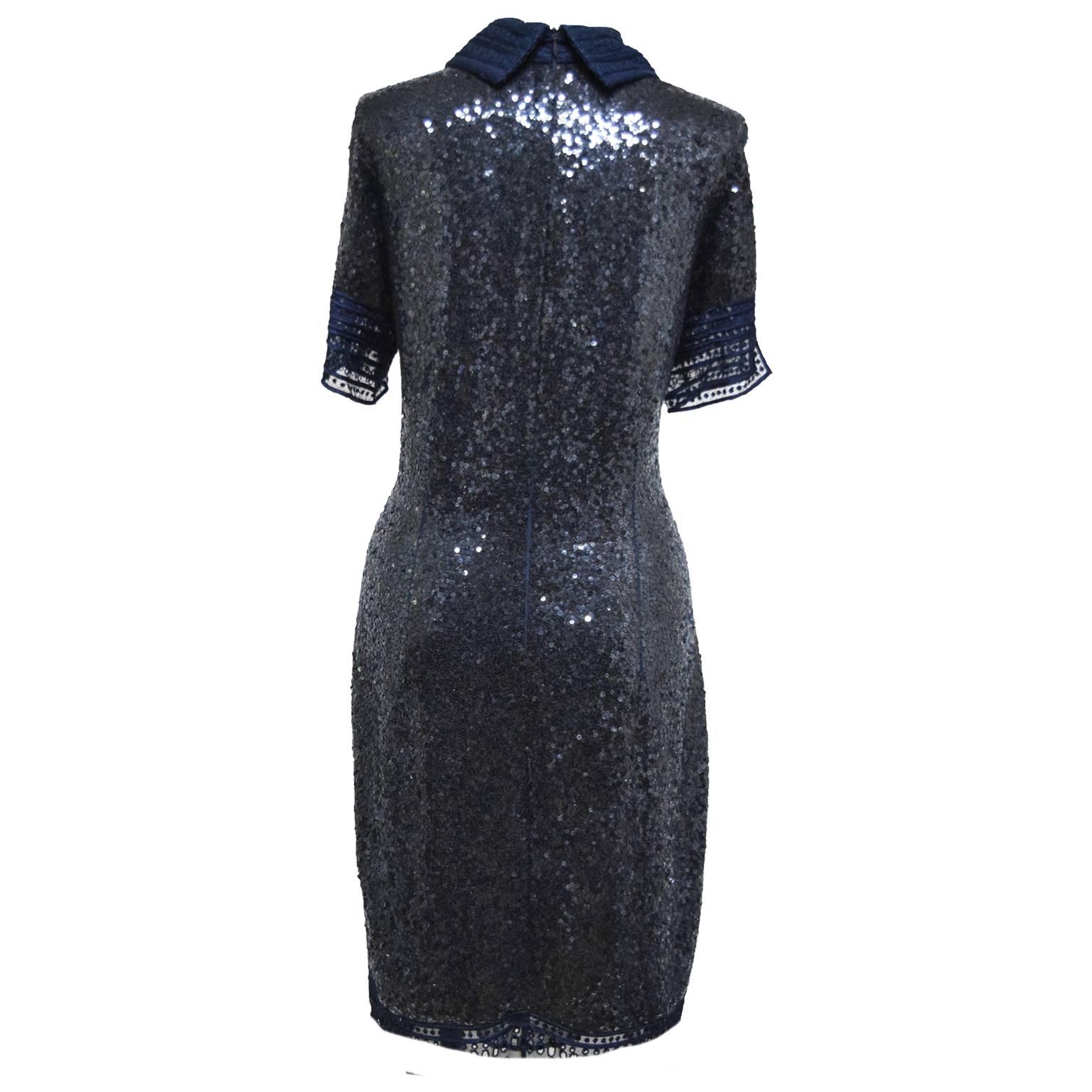 This beautiful sequins navy shirt dress can be worn for any occasion. Made out of silk and lace, this cocktail dress has an upscale elegant, but casual style to it. Hand sewn sequins are on the overall dress, while brocade lace is used as