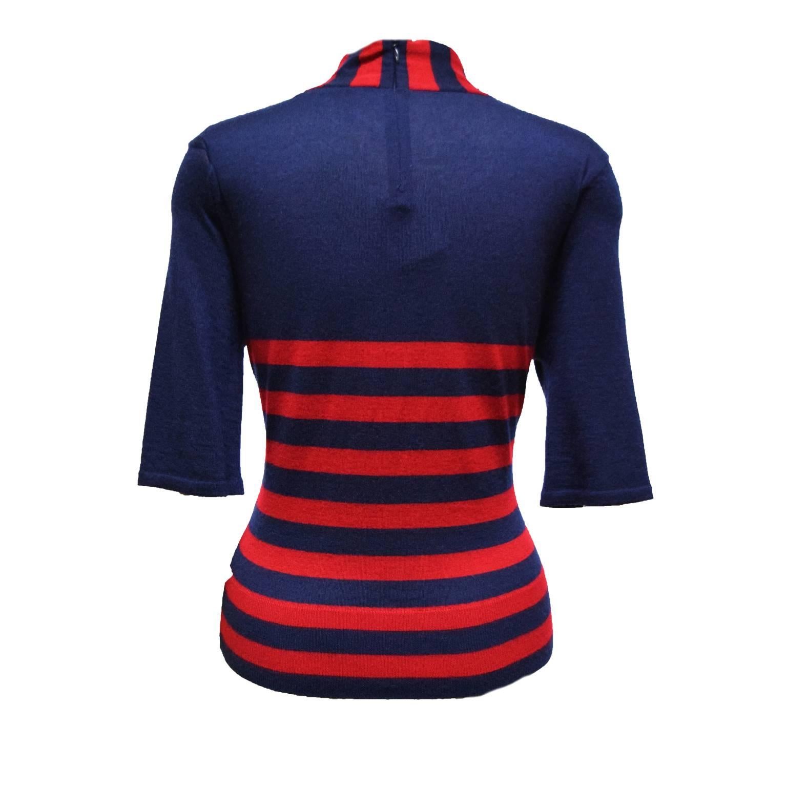 This Ralph Lauren knit sweater is made from the purple label collection. It is navy and red striped cashmere, and has three-quarter sleeves. The neckline is a Trompe l'oeil creating an all American nautical look.