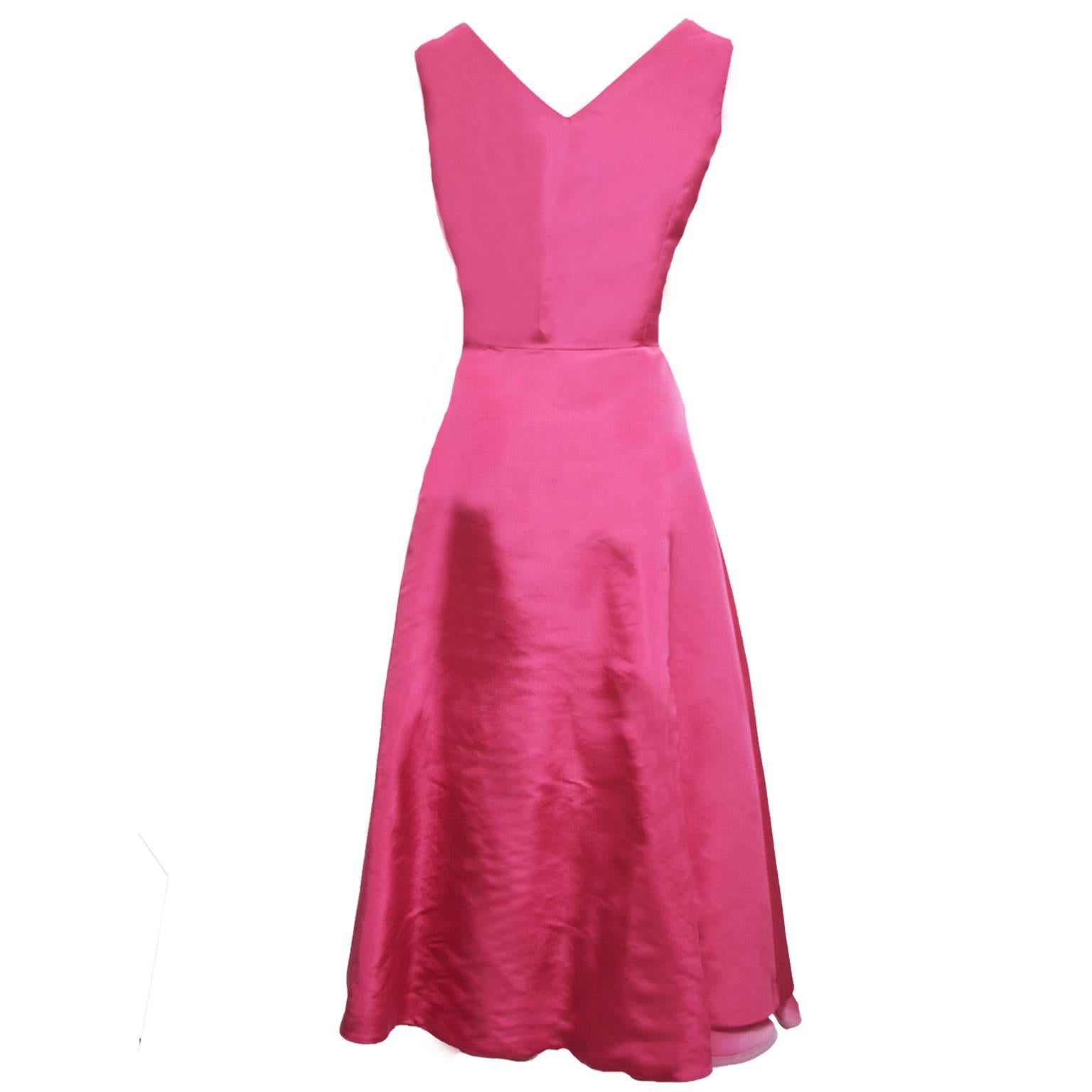 This exquisite dress by Shalini is made from rich taffeta silk, and is a two-toned layered dress in fuchsia and light pink. The neckline is a slight princess cut and the skirting is minimalistic with a basic simplistic ruffle and the end for a high