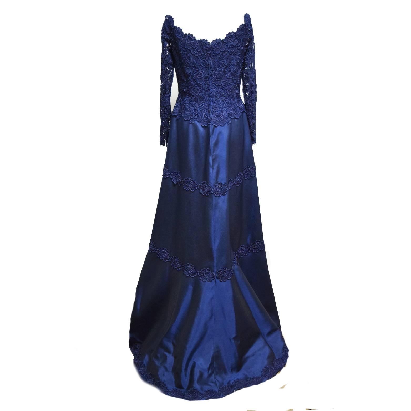 Helen Morley Navy Blue Off the Shoulder Evening Gown, Guipure Fitted Bodice and Long Sleeves, A Line Skirt with Three  Rows of Guipure Lace with the Third Row placed at the hemline, skirt has a sophisticated back train, Back Zipper Closure.