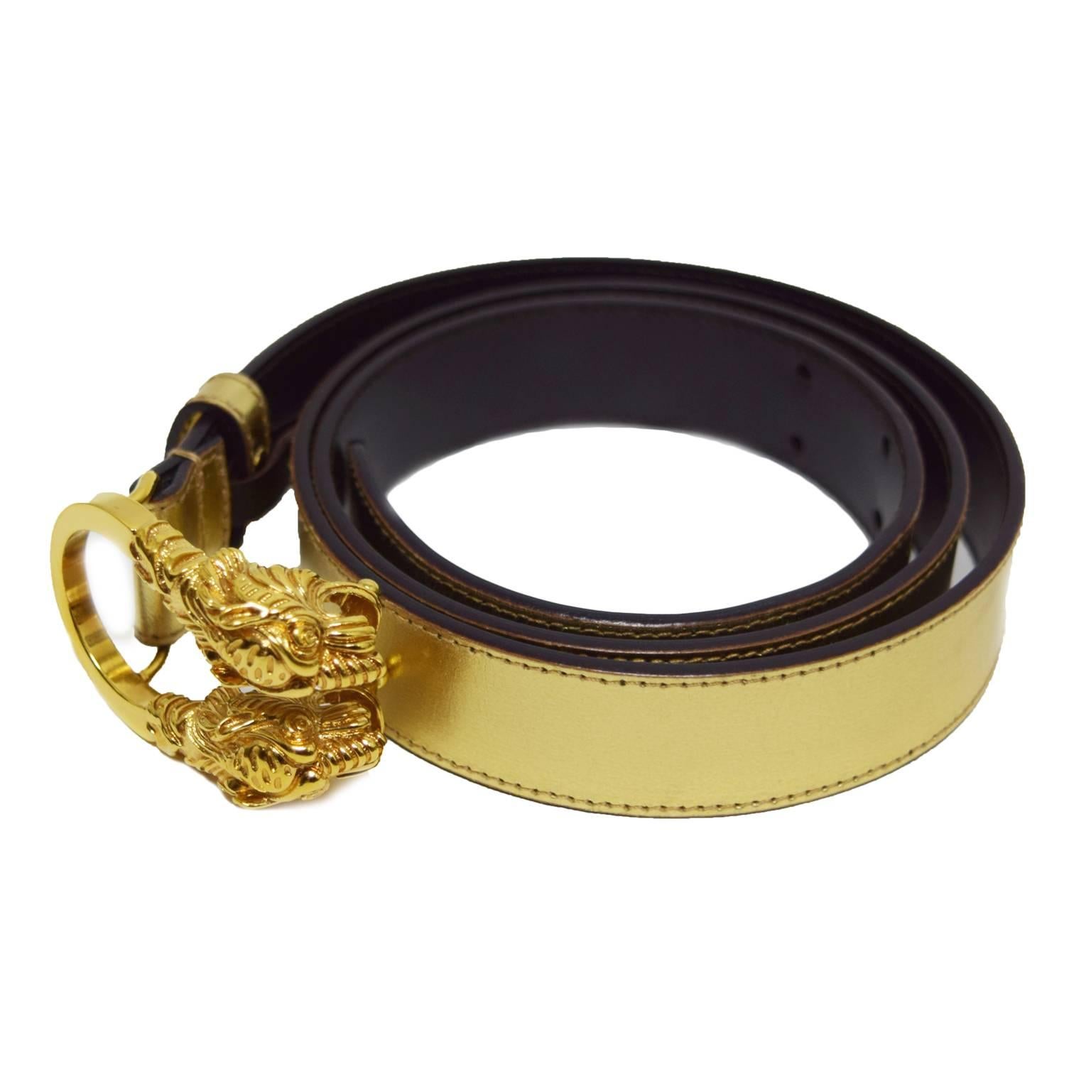 This Gucci belt is gold coated dark brown leather with gilt double headed lion buckle.

