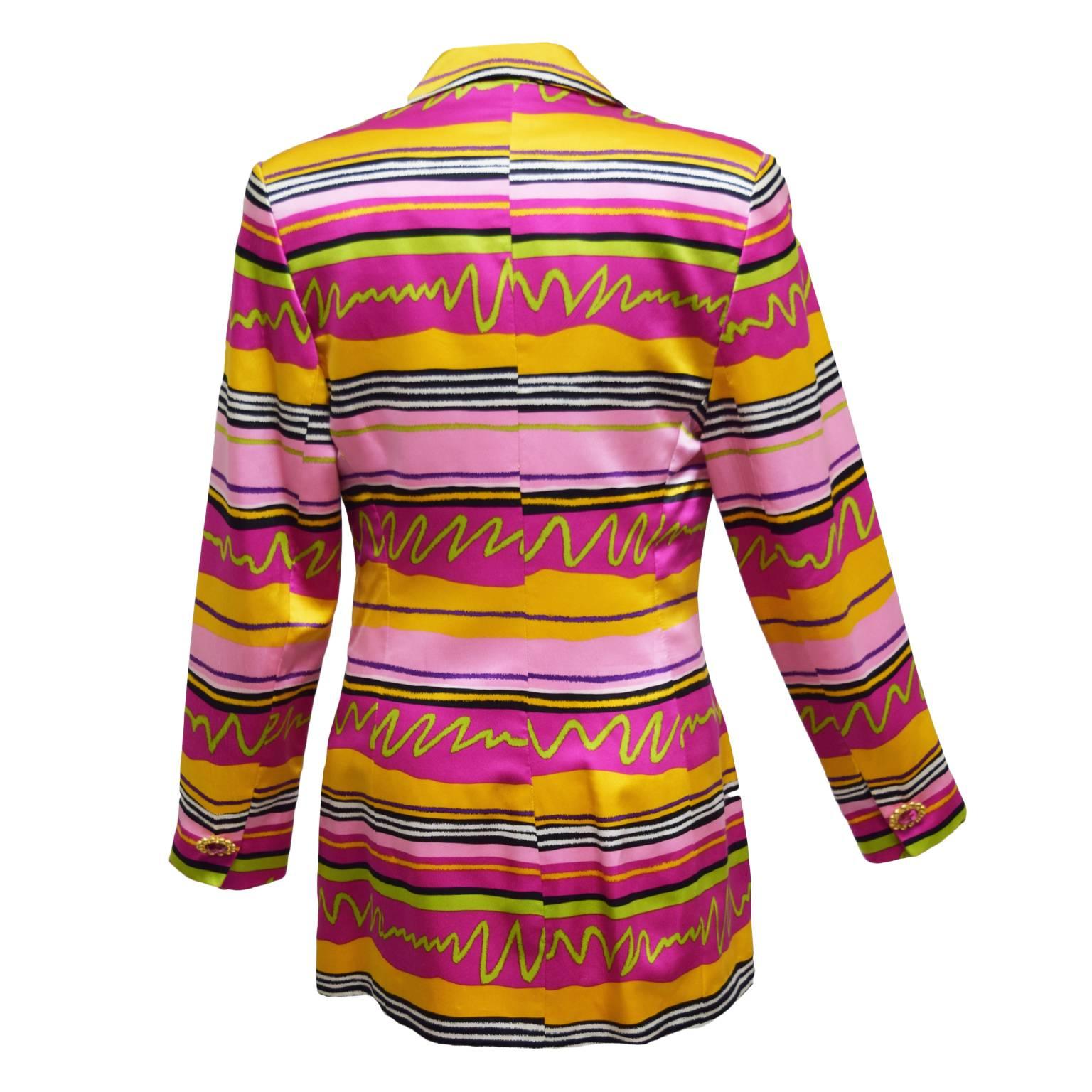 This beautiful vintage piece by Mary Ann Restivo is made and fully lined with 100% silk. The print is a multicolored abstract striped print and the single lapeled jacket has a jeweled button closure. 