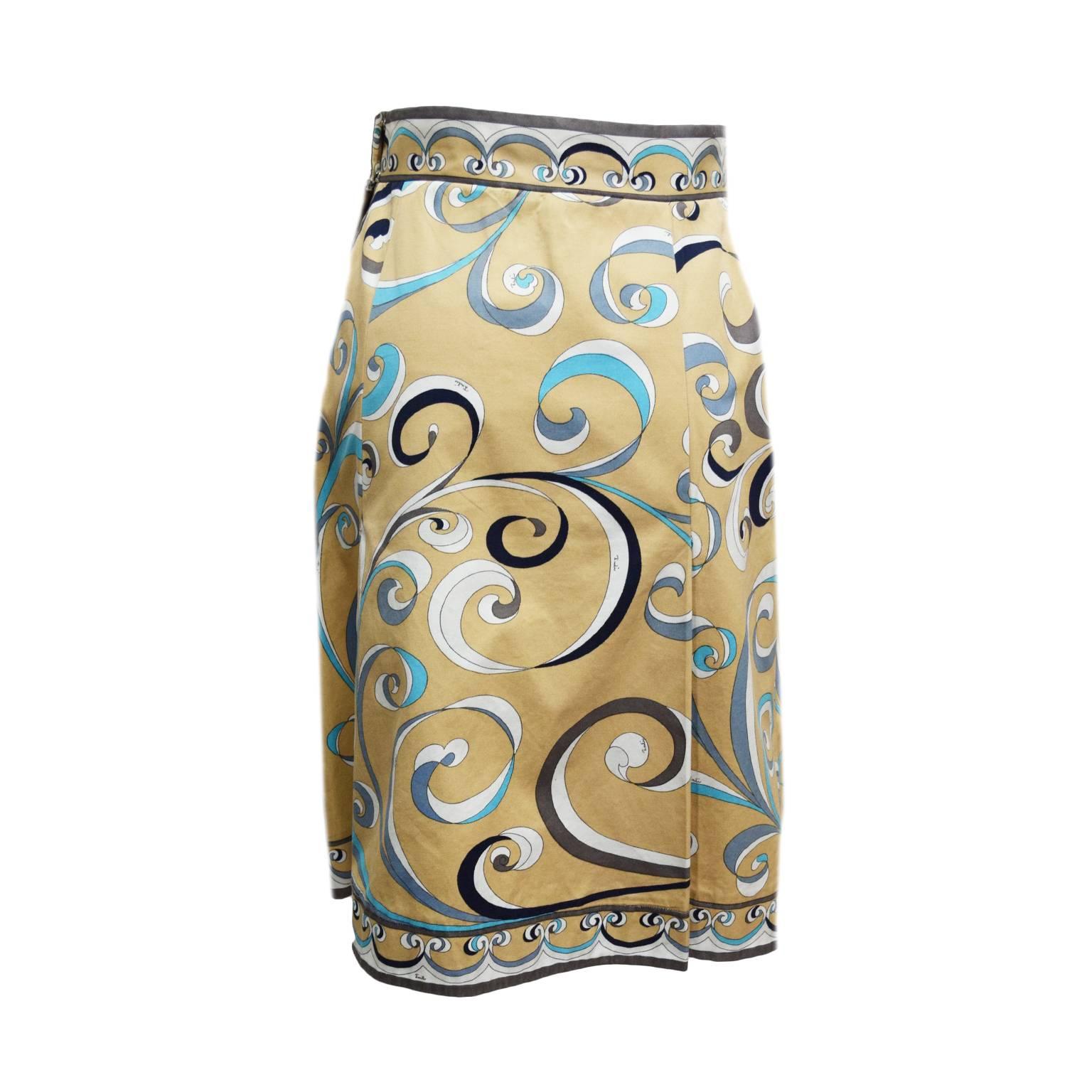 This Emilio Pucci skirt is made from 100% cotton and is printed. Both the front and back of the skirt has a paneled pleat. The skirt is an alined silhouette and a zipped back closure. 